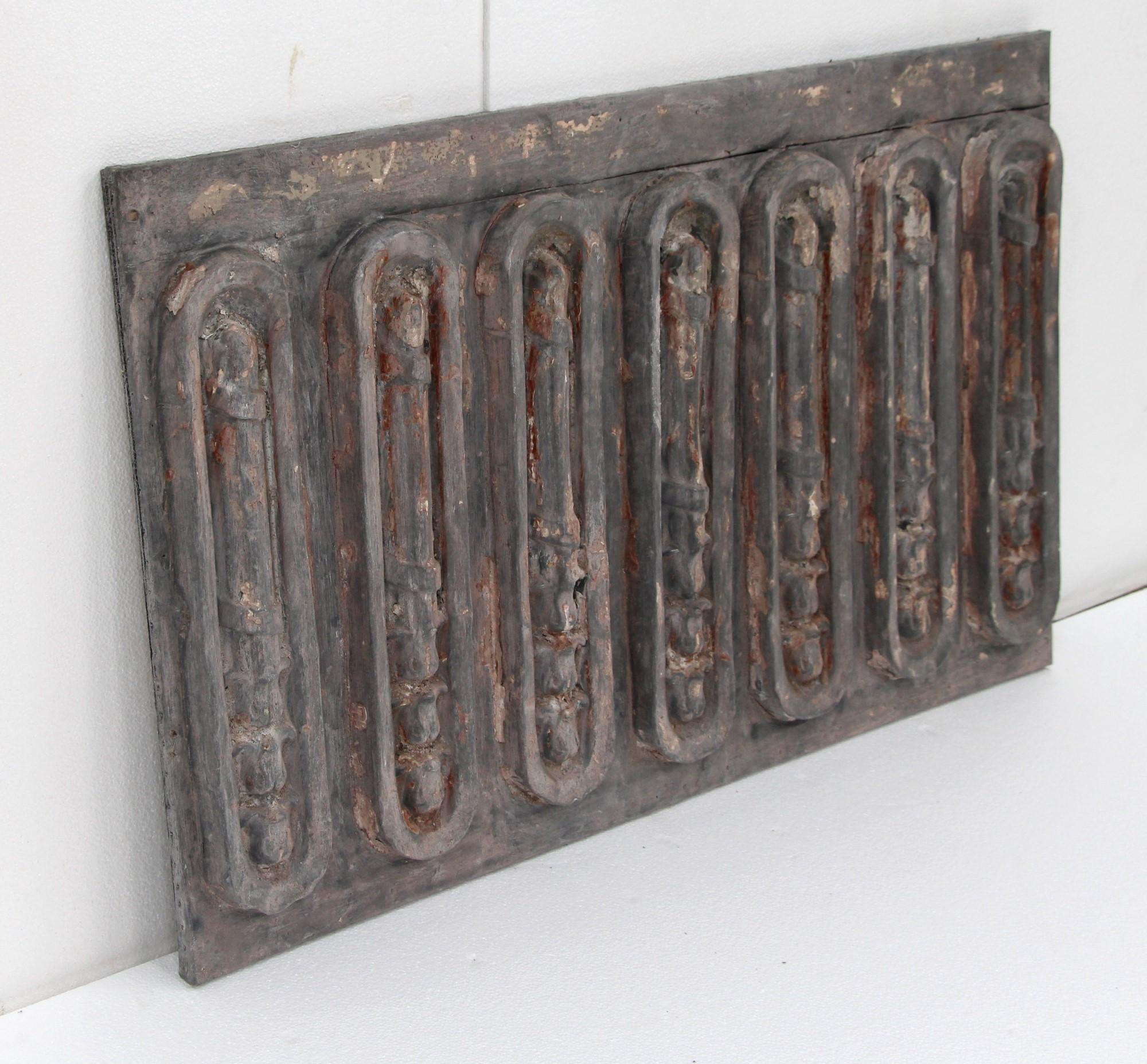 Raised decorative zinc panel wall mount retrived from a 1920s New York City building on the northwest corner of 5th Ave and West 43rd St. Mounted on a wood frame. This would make a great decorative piece for over a mantel or on a wall. One