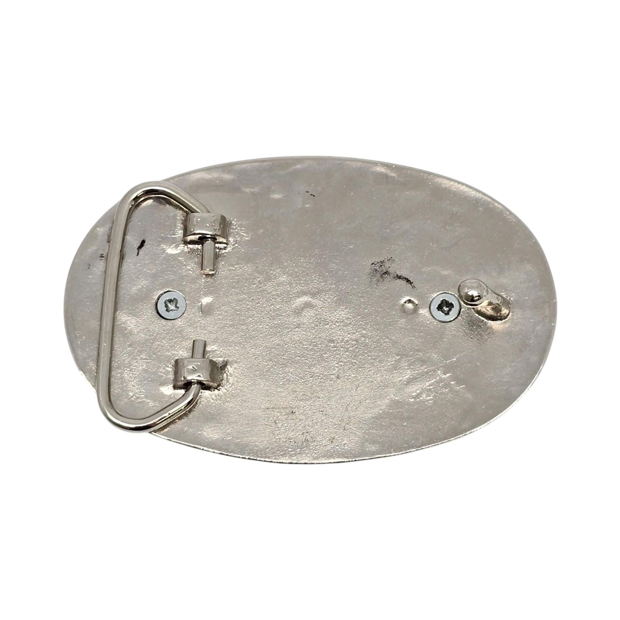1921 Morgan silver dollar coin belt buckle.

The bracelet is not silver, it features a black and silver scroll frame and a nicely toned 90% silver Morgan Silver Dollar.

Measures approx 3 1/2