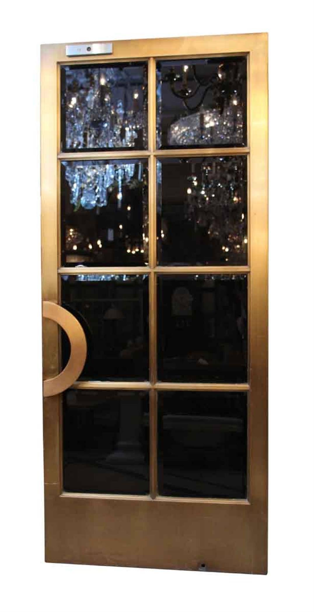 Pair of bronze Art Deco style doors with black painted beveled glass from the famous Crown building at 57th and 5th Avenue in Manhattan, circa 1921. They are from the same architects who did Grand Central. Warren and Wetmore of the Helmsley. Priced