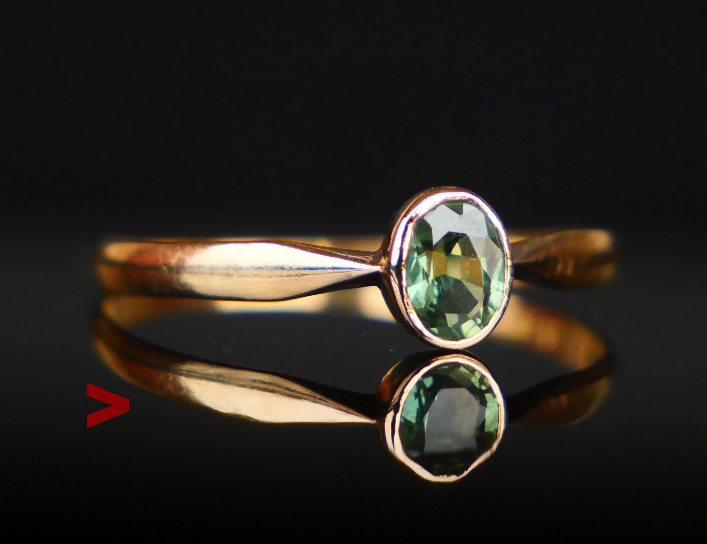 A Ring with plain shoulders featuring a bezel set natural Green Sapphire oval cut 5.25 x 4 x 2.15  mm deep / ca. 0.5 ct. Green Color of medium intensity. Stone demonstrates internal structure typical for naturals.

Swedish hallmarks, maker's and 18K