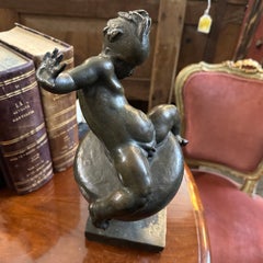 A 1922 Art Deco Bronze Italian Sculpture Child on a Spinning Top by T. Montini