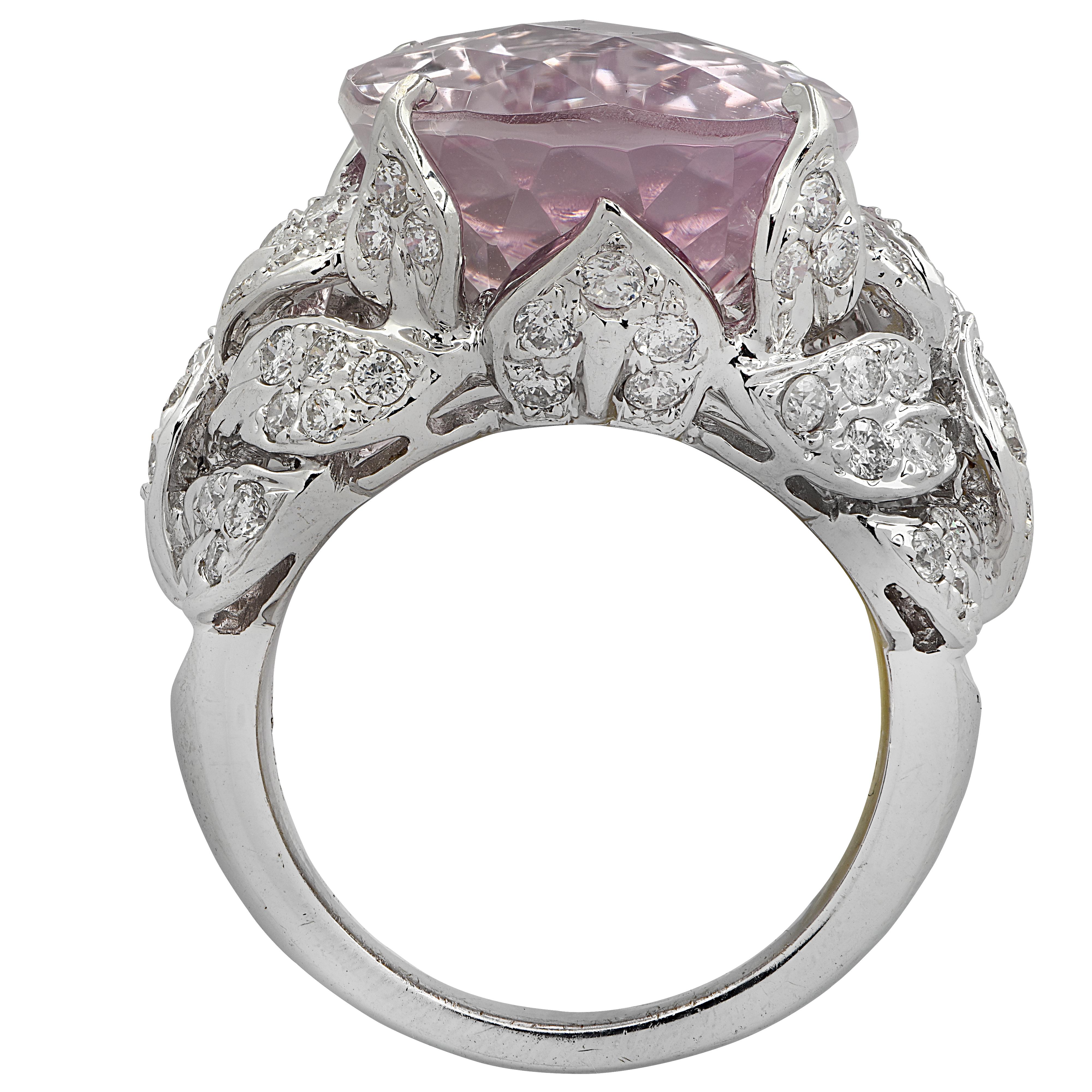 Spectacular cocktail ring crafted in 18 karat white gold showcasing a gorgeous pink oval fantasy cut Kunzite weighing approximately 19.22 carats and 80 round brilliant cut diamonds weighing approximately 1.32 carats total, G color, VS-SI clarity.