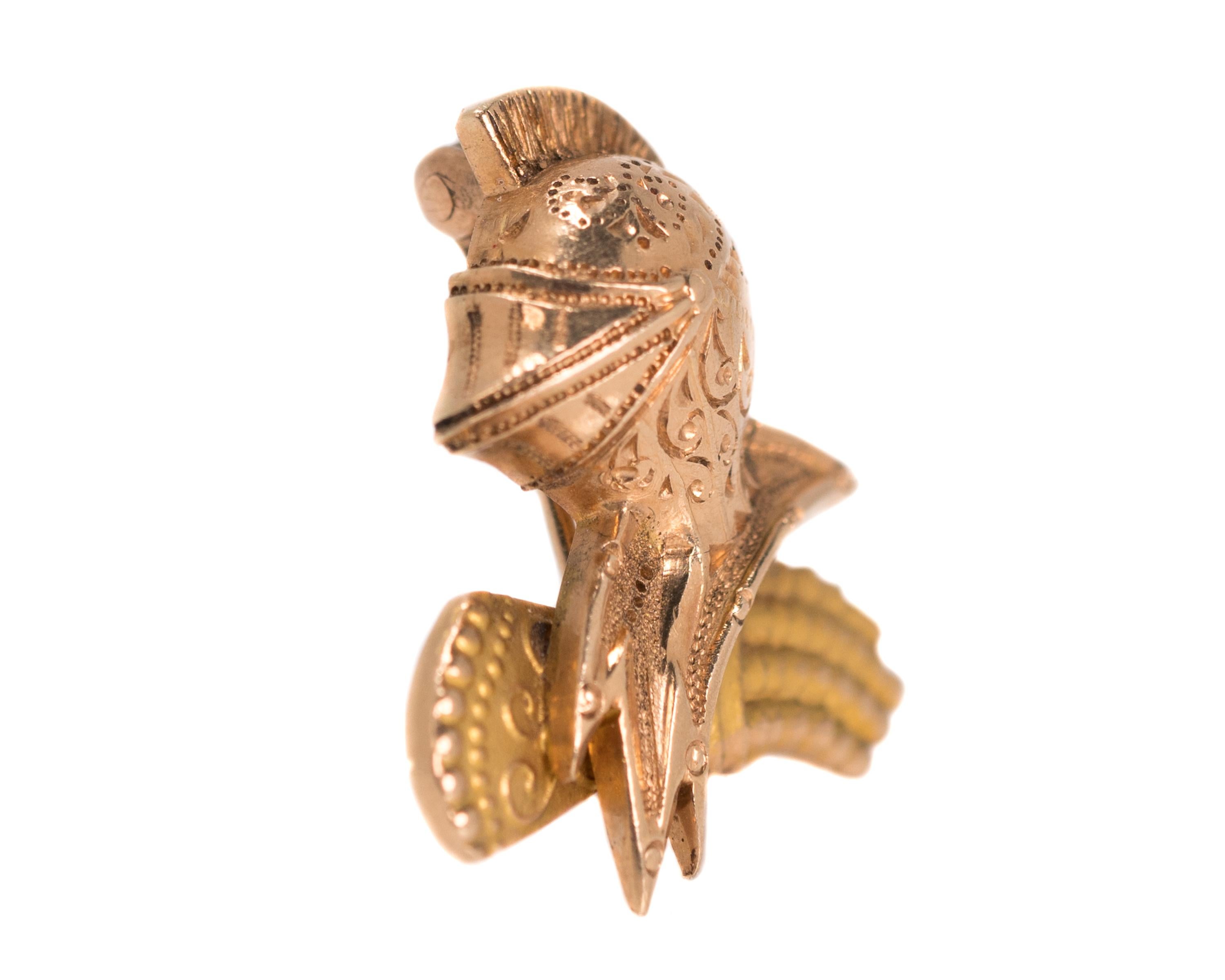 1922 Art Deco Knight's Pin with Helmet, Gorget and Gauntlet - 14 Karat Yellow Gold, Rose Gold

Features: 
Medieval Knight's Helmet with Gorget and Gauntlet 
Gorget layered over the Gauntlet
Very finely detailed design
Scrollwork and dotwork