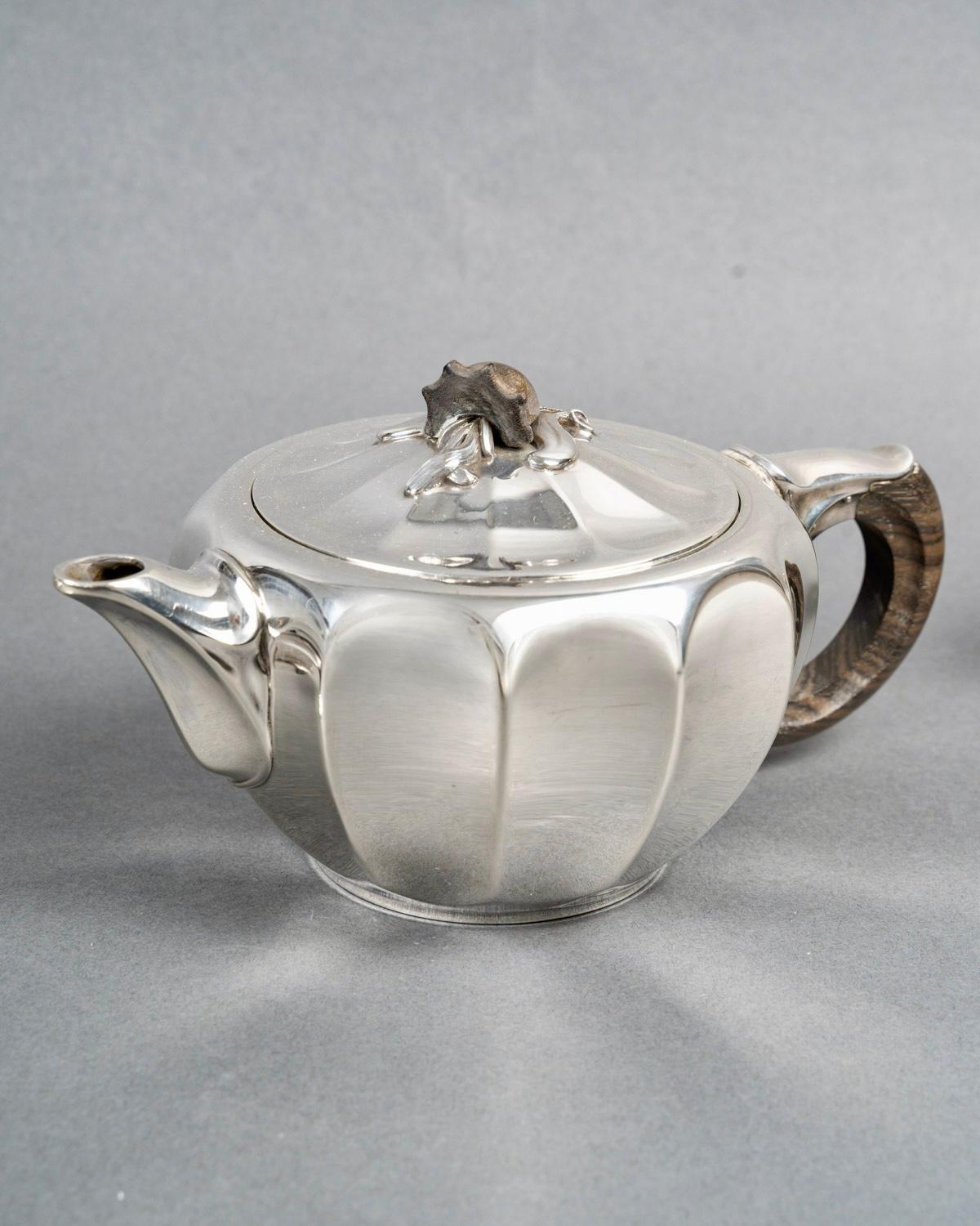 Tea and coffee service in sterling pure silver and nephrite by Jean E. Puiforcat.

Service including :
- a coffee pot 
- a milk jug 
- a sugar pot 

Minerve Solid Silver 950/1000 French mark - maker's stamp and signature on each piece.

Gross
