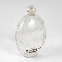 Bouteille de parfum en verre transparent Le Temps des Lilas de René Lalique pour Houbigant, 1922