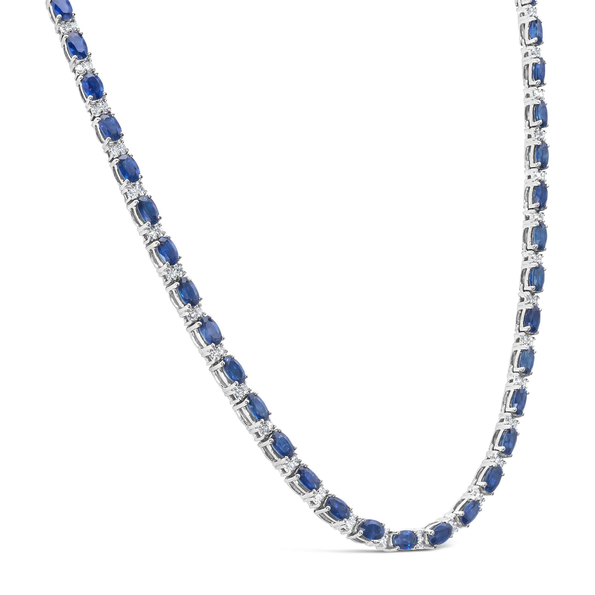 A charming tennis necklace, featuring an alternating style of oval cut blue sapphires weighing 17.62 carats total and round cut diamonds weighing 1.61 carats total. Finely made with 14K white gold, 16 inches in length. Perfect for casual or formal