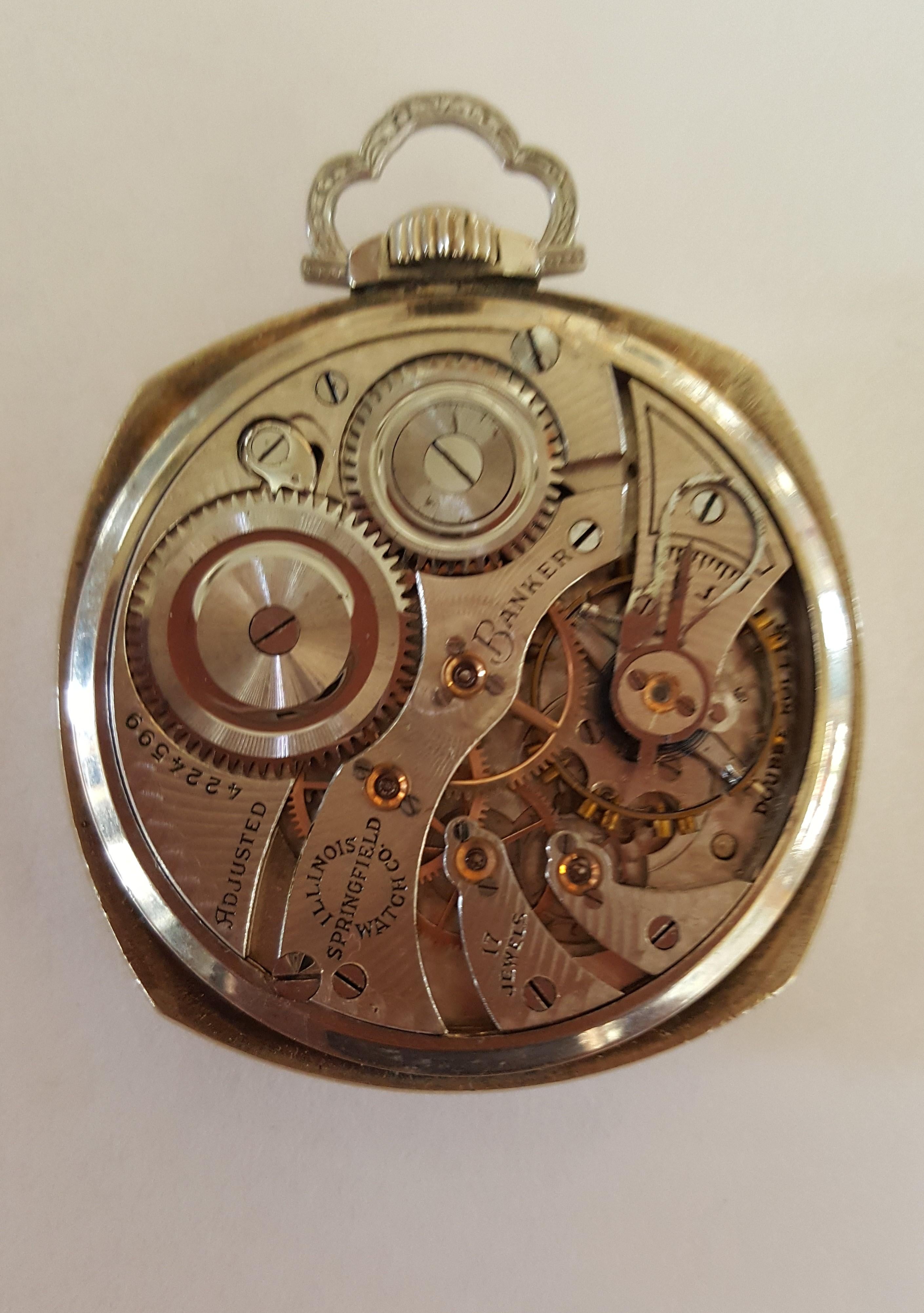 1923 Illinois Pocket Watch, Banker, 14k White Gold Filled, Working, 12s Size, 17 Jewel, Openface, Squared Case, 43 mm Case, Adjusted. Beautiful engraved design. Black Arabic Numerals, Chronograph, Acrylic clear cover.

This watch has not been