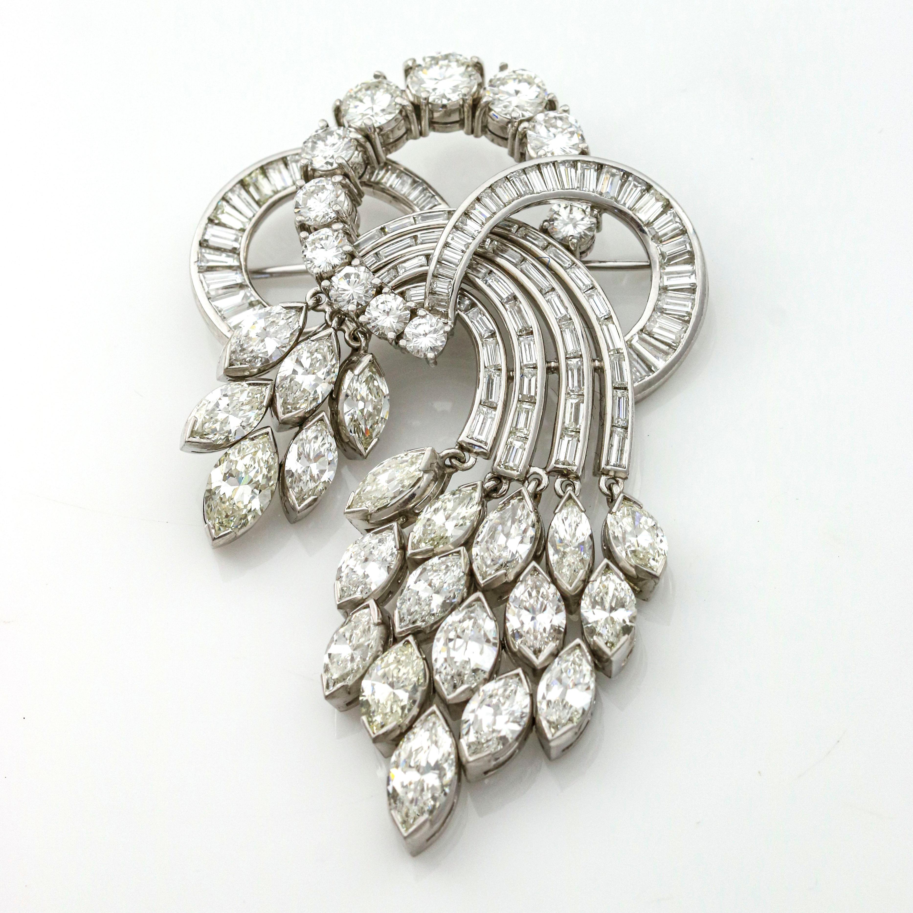 Aria diamond brooch in platinum. Circa 1950s. The brooch has 21 marquise cut diamonds, 11 round brilliant cut diamonds, and numerous baguette cut diamonds. Diamond color G-I, clarity VS-SI.

Diamond Total Carat Weight, 19.24 Carats