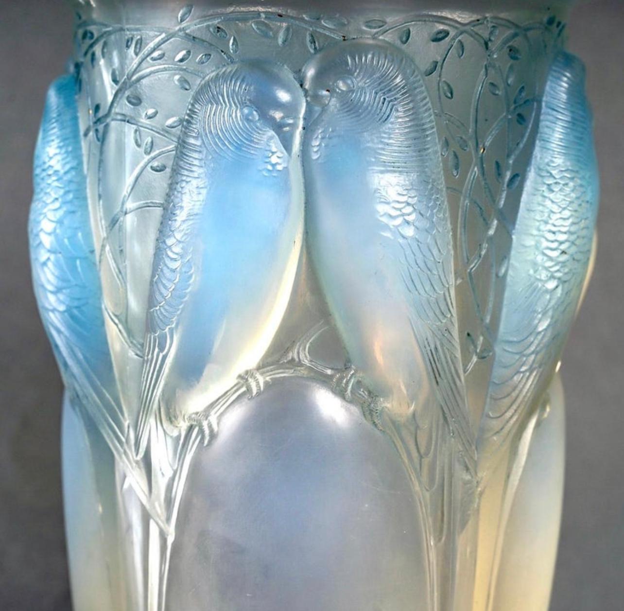 Vase “Ceylan” made in opalescent glass with blue patina by René Lalique in 1924.
Engraved signature.

Perfect condition.

height: 24 cm

Félix Marcilhac, René Lalique - Catalogue Raisonné de l'Œuvre de Verre, Les Éditions de l'Amateur, Paris, 2011,