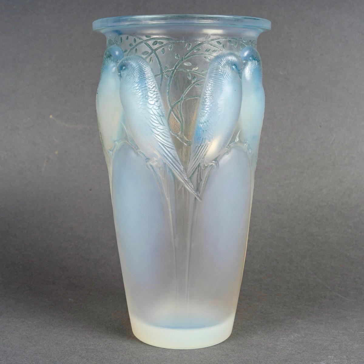 Vase “Ceylan” made in opalescent glass with blue patina by René Lalique in 1924.  
Engraved signature.    

Perfect condition. Very nice opalescence.     

height: 24 cm    

Félix Marcilhac, René Lalique - Catalogue Raisonné de l'Œuvre de Verre,