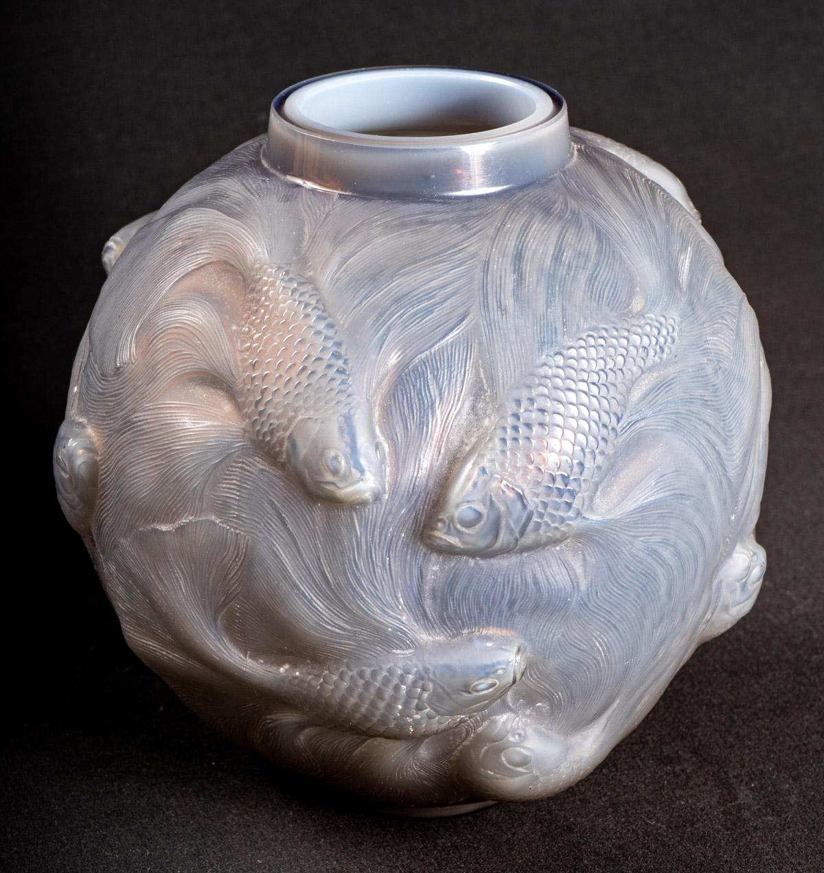 Vase “Formose” made in agate glass (cased grey and opalescent) by René Lalique created in 1924.
Molded signature on bottom.

Perfect condition. Wonderful model and very rare color. 

height: 17 cm

Félix Marcilhac, René Lalique - Catalogue Raisonné