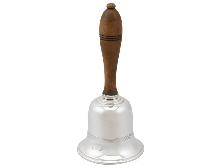 An exceptional, fine and impressive antique George V sterling silver table bell; an addition to our range of ornamental silverware.

This exceptional antique George V sterling silver table bell has a plain bell shaped form.

The bead line of the