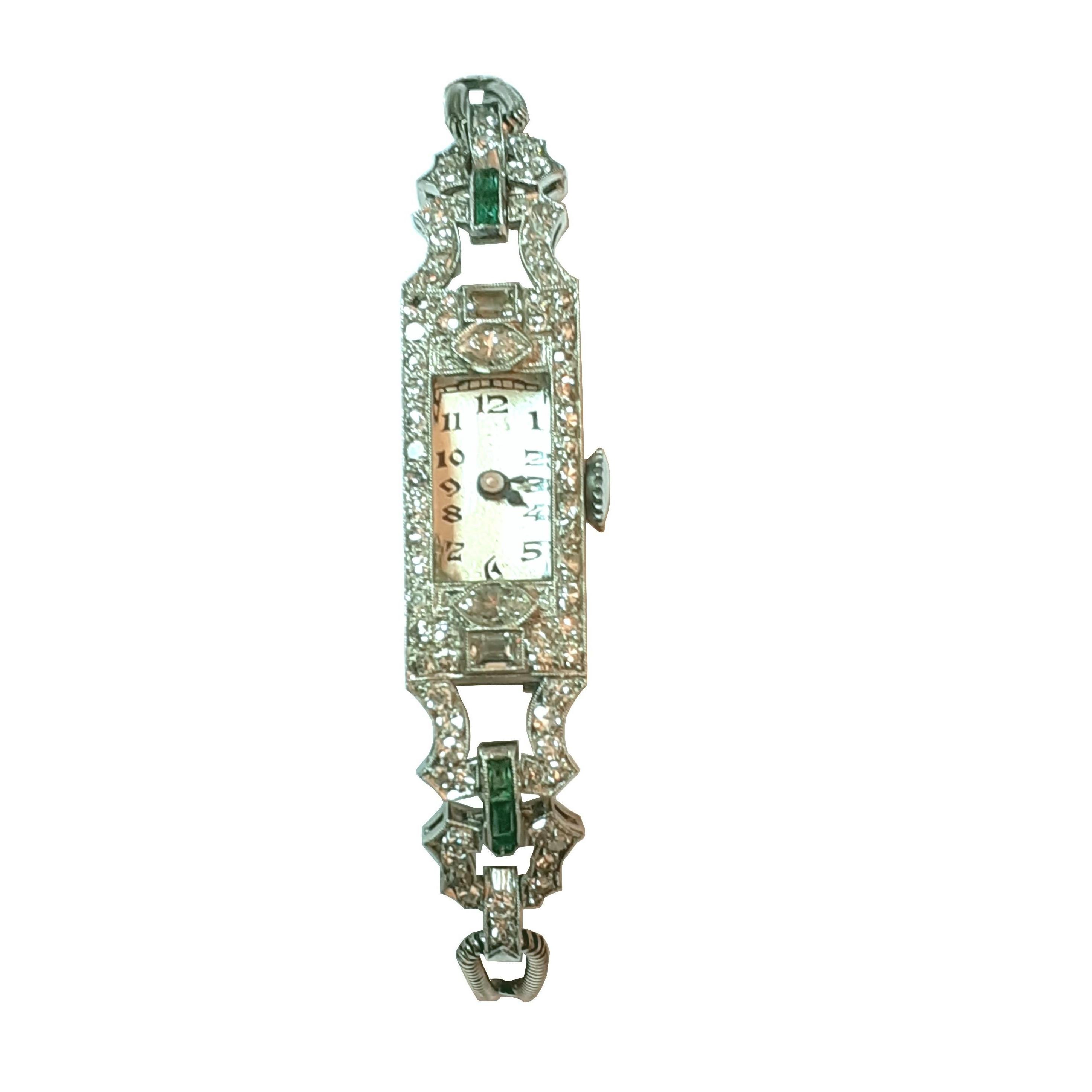 This charming Art deco lady watch is made of platinum and set with diamonds and emeralds. It has a 18K white gold strap. The original mechanic movement works well. There is an approximate total carat weight of 1.45ct of diamonds

Weight: 16.7 g