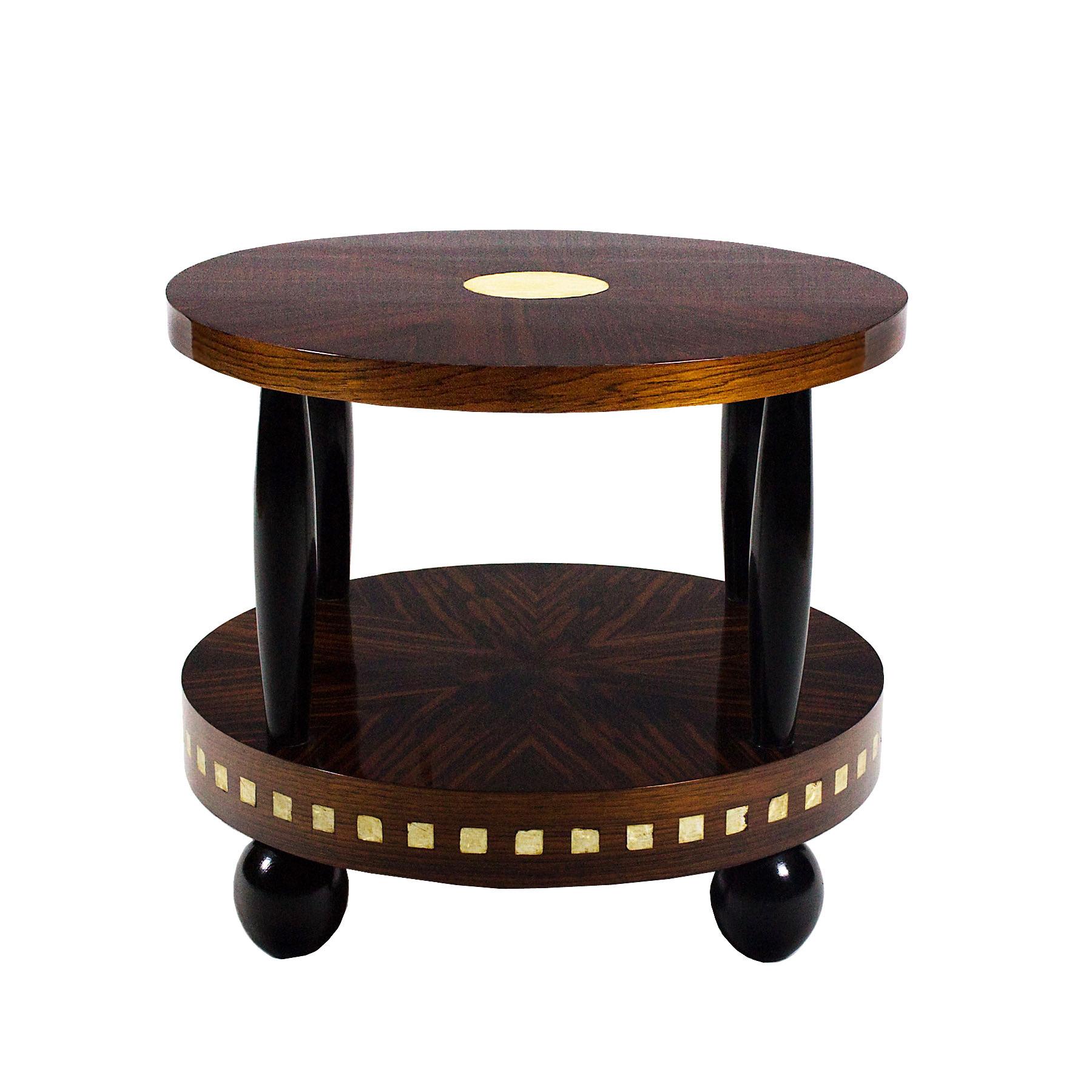 Art Deco solid wood sidetable with Macassar ebony, mahogany and celluloid veneer. Black lacquered solid oak stands and feet.

Design: Francisque Chaleyssin, (1872-1951)

France, 1925.