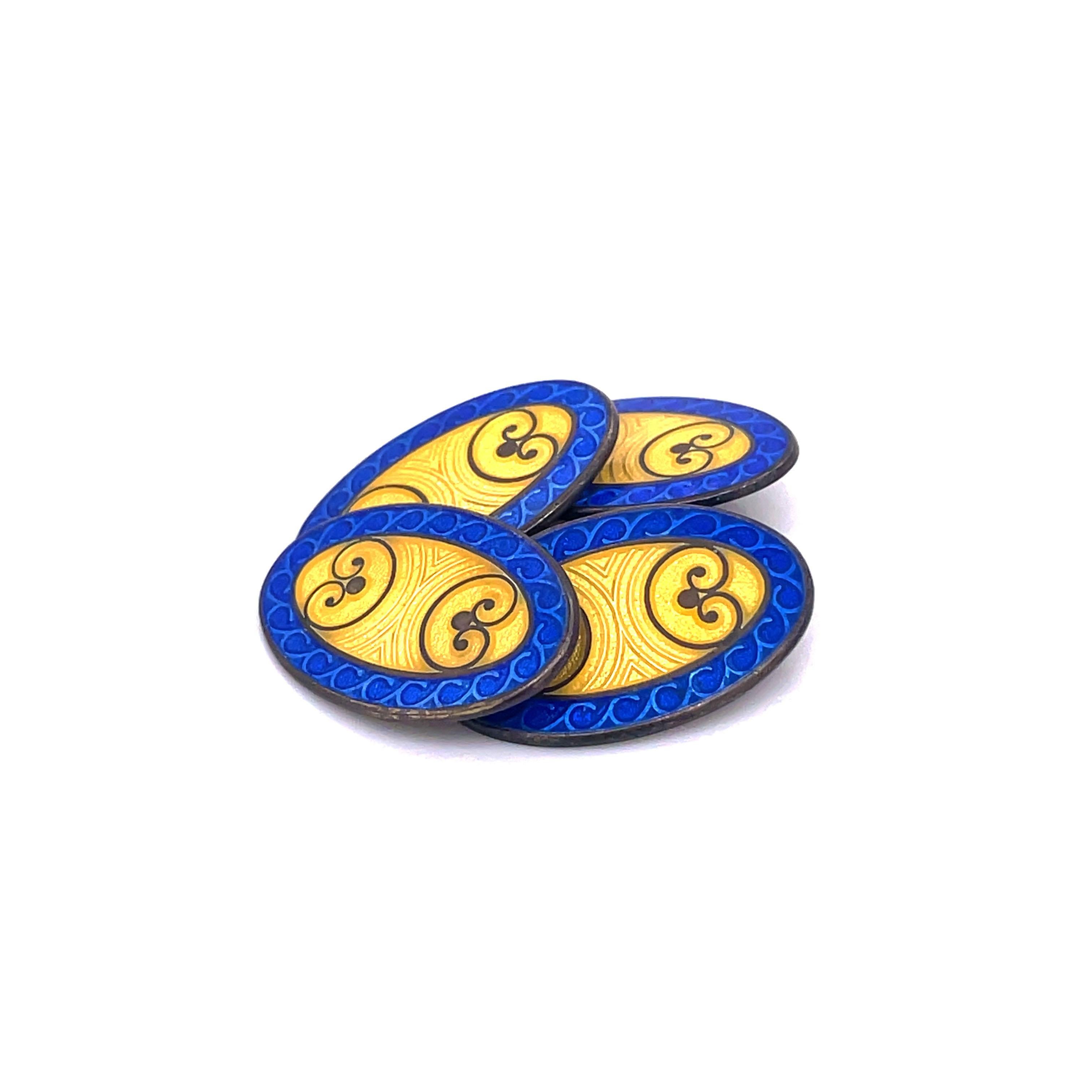 This is a striking set of Sterling Silver 1925 Deco cufflinks signed by Krementz that feature a bright and gorgeous yellow and royal blue enamel. The royal blue frame of the links is exceptional and demands attention, the bright blue harmoniously