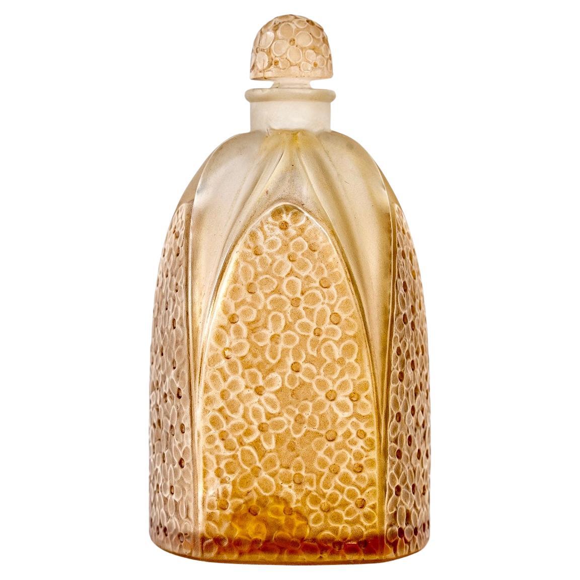 1925 René Lalique Perfume Bottle Le Lilas Frosted Glass Sepia Patina For Sale