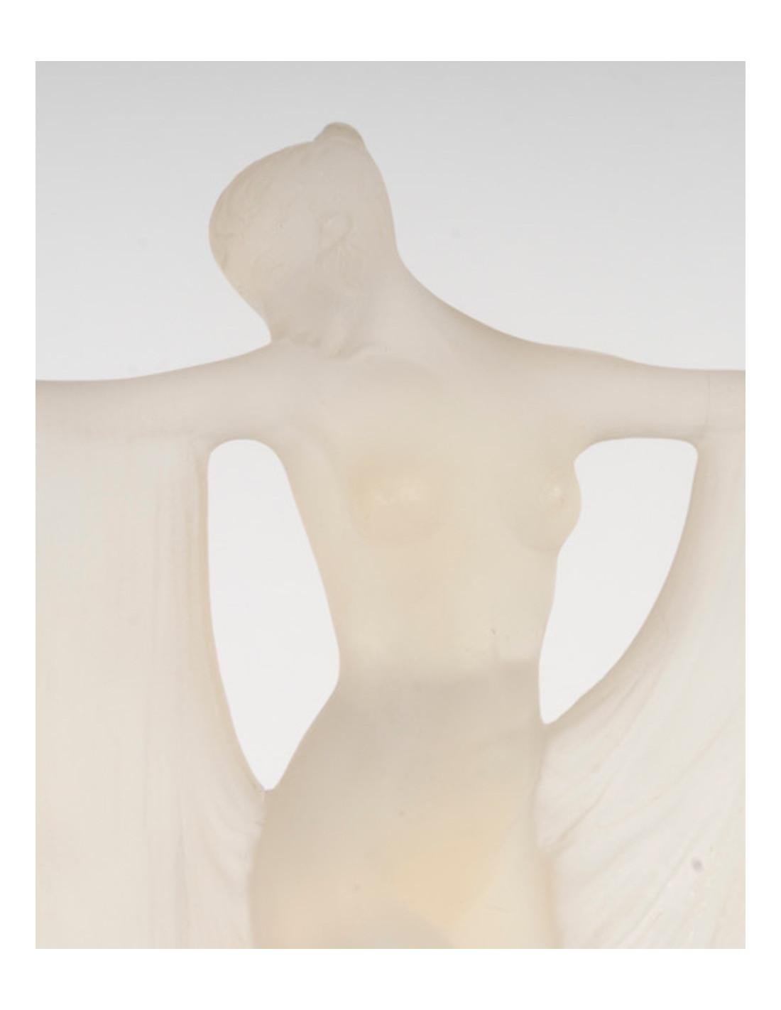 8 in.)

Signed R. Lalique FranceModel created in 1925 and removed from the catalog in 1937. 

Signature molded on the back. 

With its original illuminated and electrified bronze base.

'Suzanne' statuette, model created on July 7, 1925, not