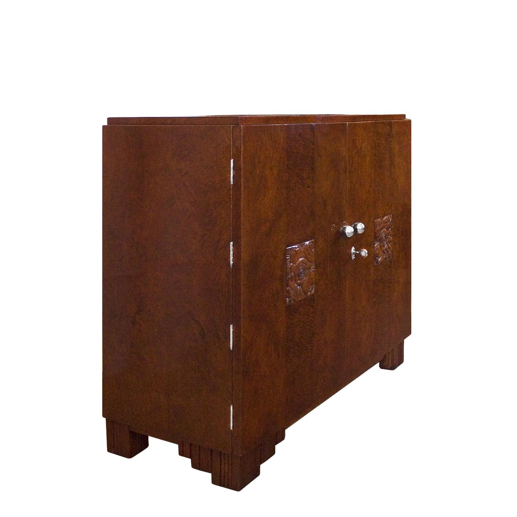 Small Art Deco sideboard with two doors, solid mahogany with mottled mahogany veneer, French polish. Decorative panels with stylized flowers pattern. Nickel-plated brass hardware and handles.
Maker: Saddier et ses Fils - Paris

France, 1925.