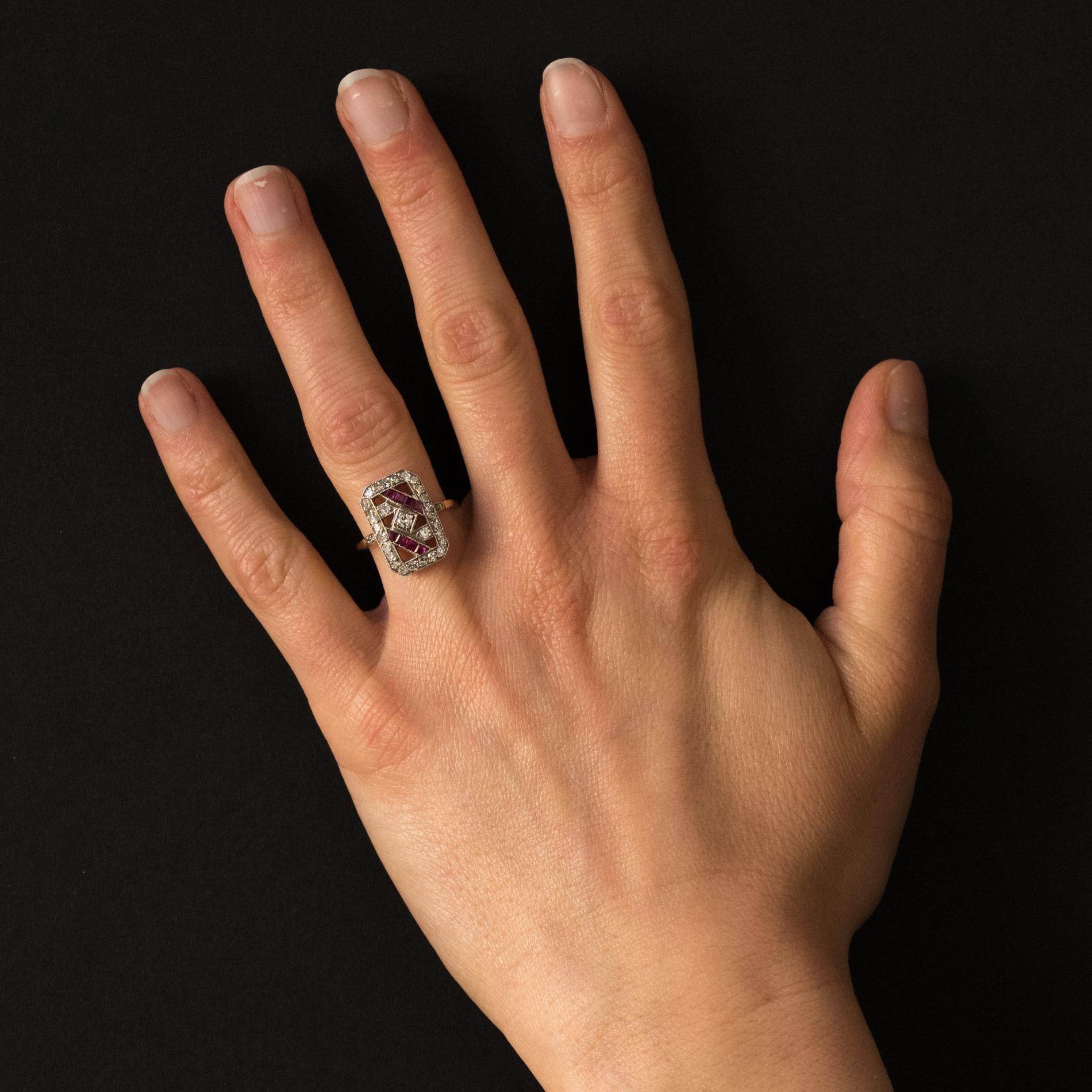 Ring in 18 karats yellow gold, owl hallmark and silver, swan hallmark.
Lovely antique ring of rectangular shape, it is set on a perforated tray and totally flat on the finger, of calibrated diamonds and synthetic ruby. On both sides of the head, on