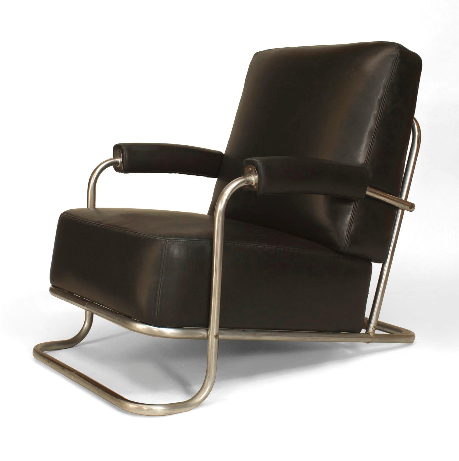 French Art Deco tubular chrome arm chair with black leather upholstered seat and back cushion (designed by R.C. COQUERY for THONET, Model #B 256 lounge chair, 1929).
 