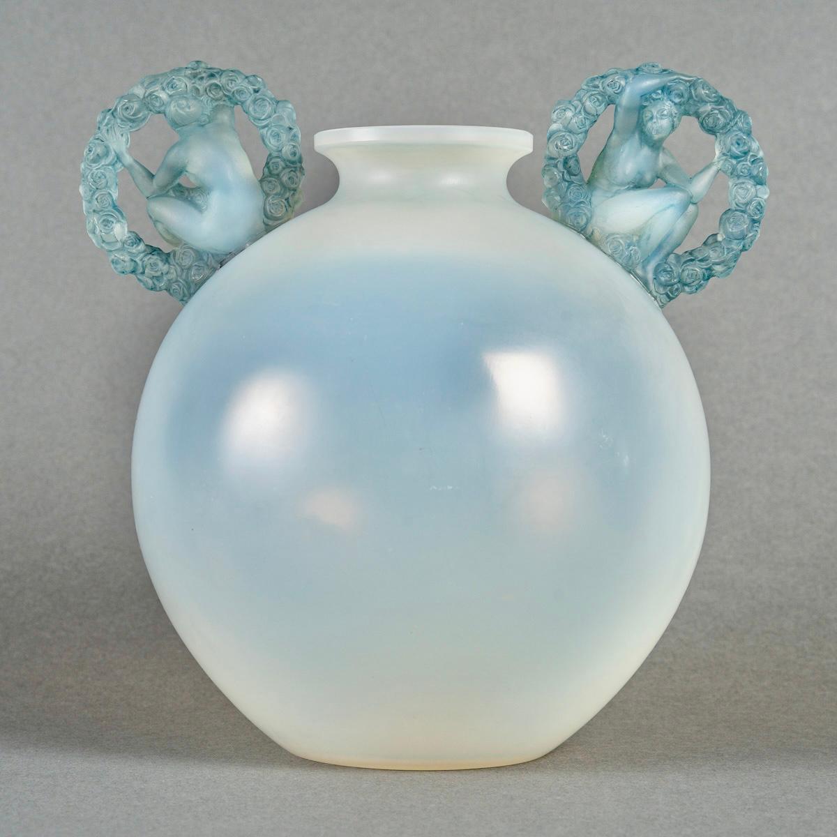 Vase “Ronsard” made in cased opalescent glass with blue patina by René Lalique in 1926.
Molded signature.

Perfect condition. Original glued handles. Great opalescence. 

height: 21 cm

Félix Marcilhac, René Lalique - Catalogue Raisonné de l'Œuvre