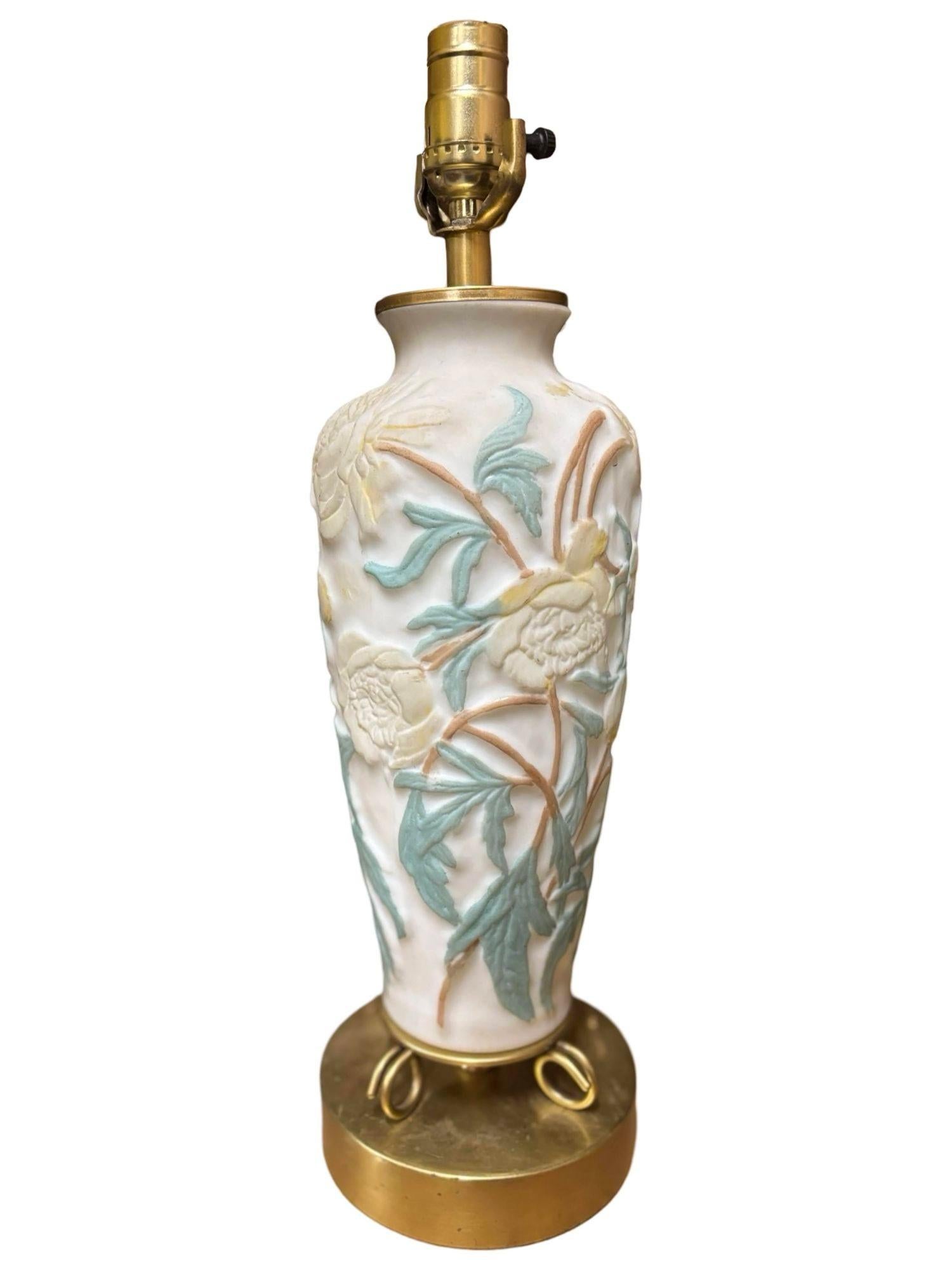 Original Consolidated Phoenix Glass showcases the refined elegance of a floral cameo of Peonies with green leaves. Its opaque satin white glass base is adorned with delicately embossed floral motifs largely influenced by Art Nouveau. The intricate