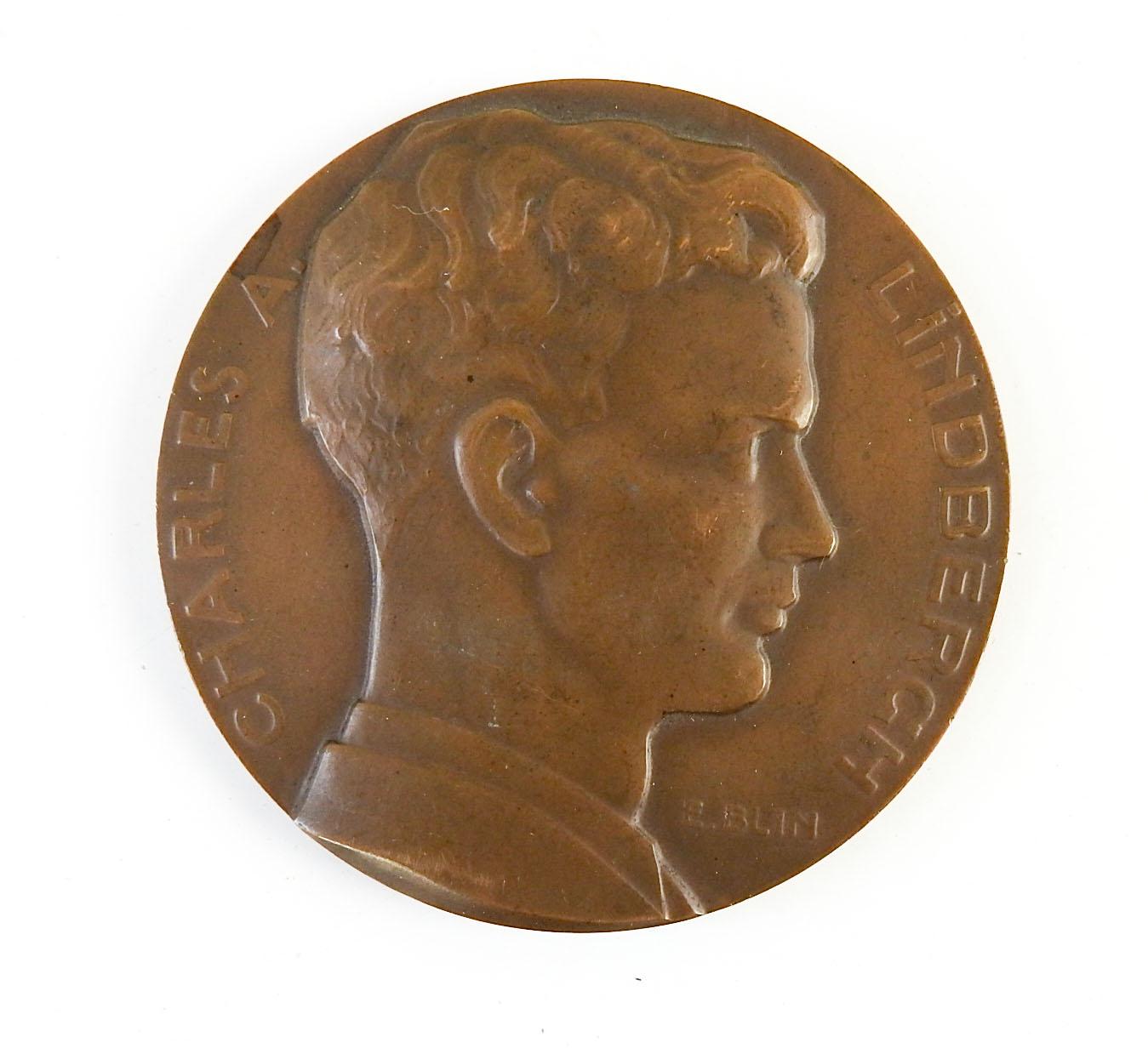 Circa 1927 bronze medallion commemorating Charles Lindbergh and Spirit of St. Louis, sculptor Edouard-Pierre Blin.  Signed E. Blin, produced by Henri Teterger,  the obverse with Lindbergh's profile while the reverse commemorates the aviator's
