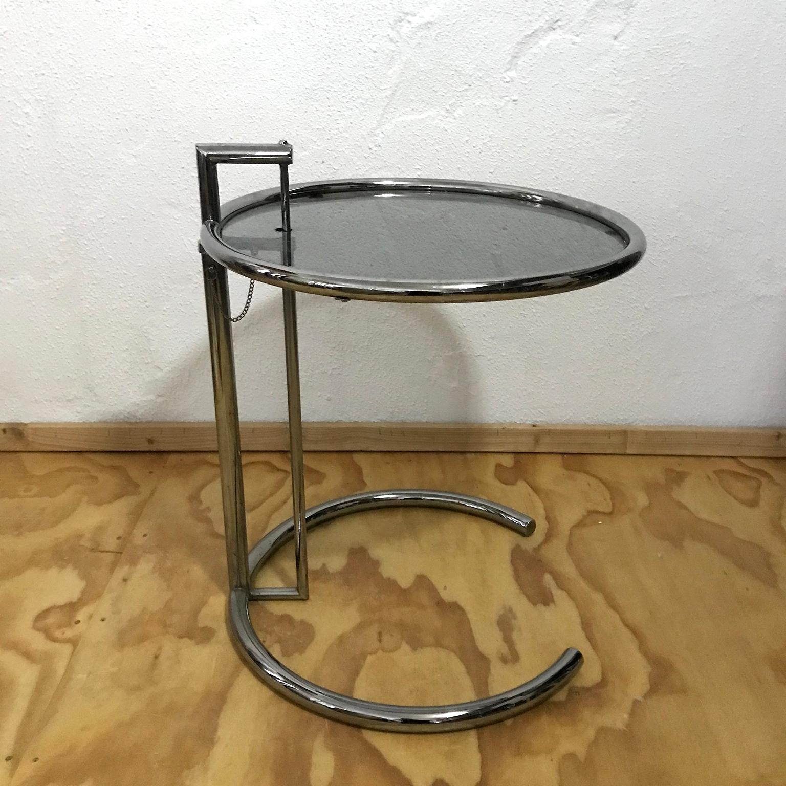 
Adjustable Table E 1027

Designer	Eileen Gray
Date	1927
Materials	: On Request ; Stainless steel, tempered glass, Smoked Glass or Clear Glass 
Style / tradition	Modernist
Height	54 cm (21 in)—93 cm (37 in)  Adjustable Table
Table E 1027 is an