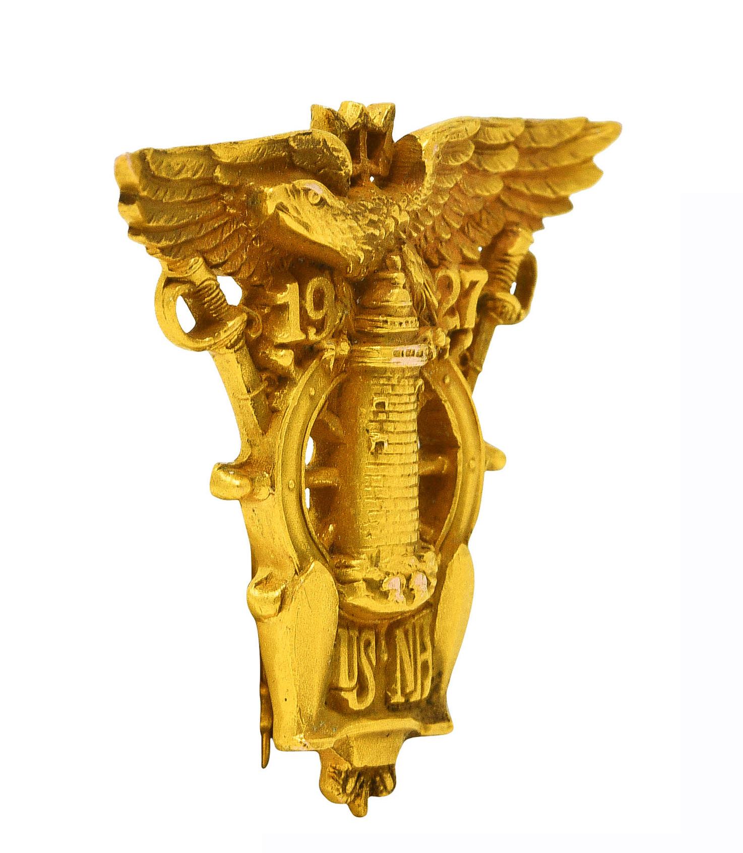 Brooch is designed as a highly rendered eagle with spread wings atop a lighthouse

Featuring a grooved helm and mirrored sword motif

With the text '1927 US NA' for the US Naval Academy class of 1927

Completed by hinged pinstem with locking