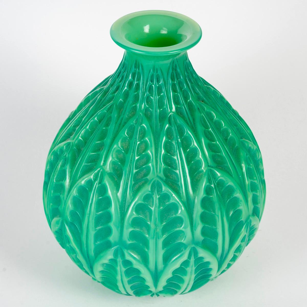 Vase “Malesherbes” made in cased jade green glass with green patina by René Lalique in 1927.
Engraved signature on bottom.

Perfect condition. Extremely rare color. 

height: 23 cm

Félix Marcilhac, René Lalique - Catalogue Raisonné de l'Œuvre de