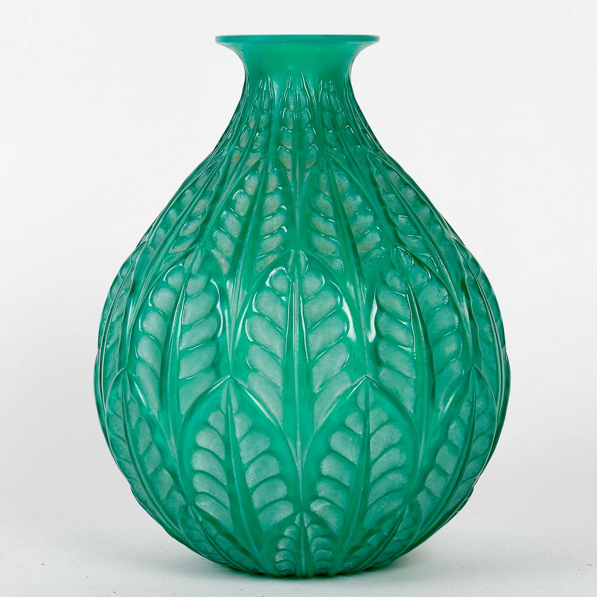 Vase “Malesherbes” made in double cased jade peppermint green glass with white patina by René Lalique in 1927.
Engraved signature on bottom.

Perfect condition. Extremely rare color.

height: 23 cm

Félix Marcilhac, René Lalique - Catalogue Raisonné