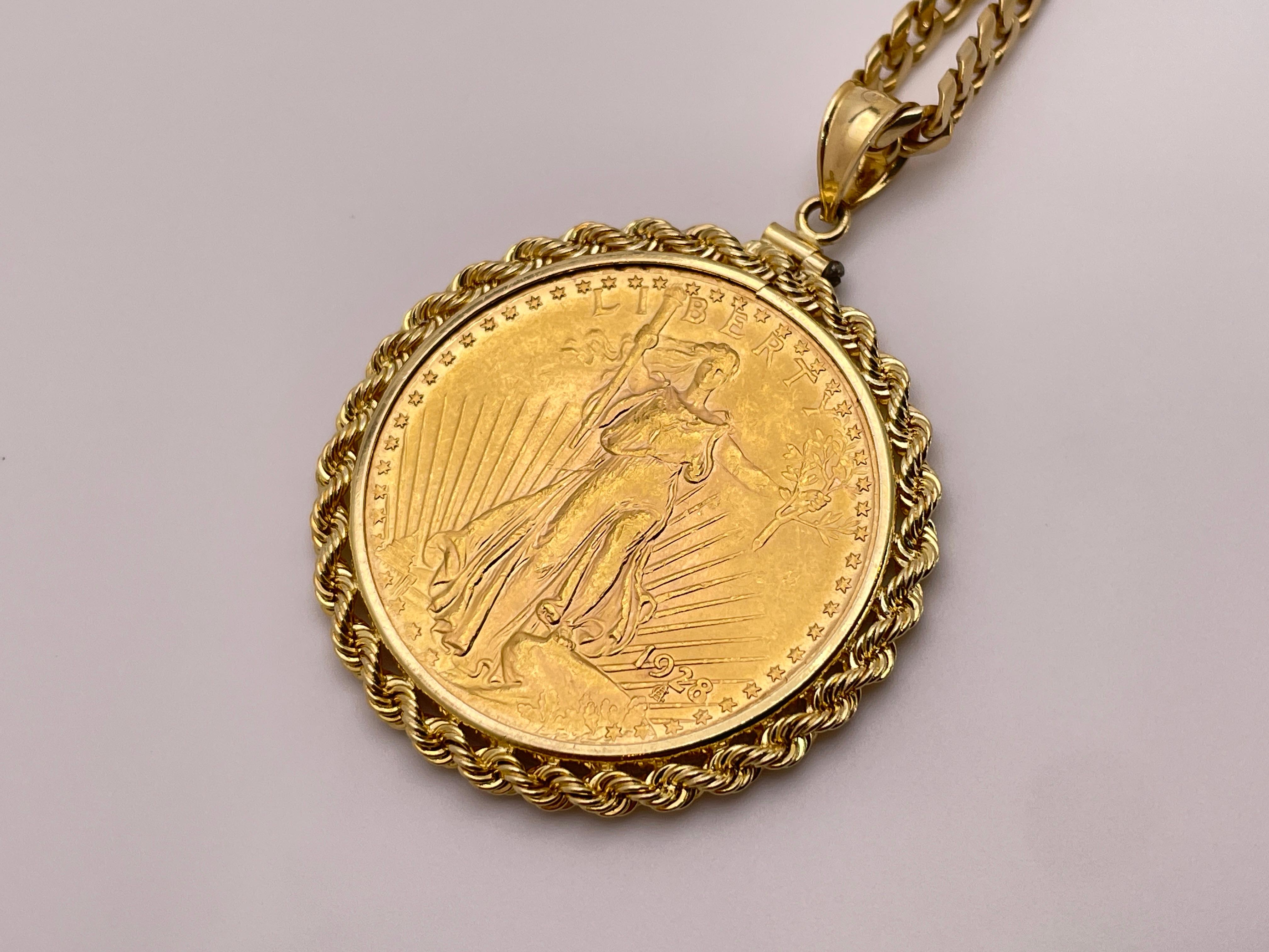 A 1928 $20 Saint-Gaudens double eagle gold coin pendant, mounted in a 14K yellow gold twisted vine frame, accompanied by a 18K yellow gold 24-inch chain.

