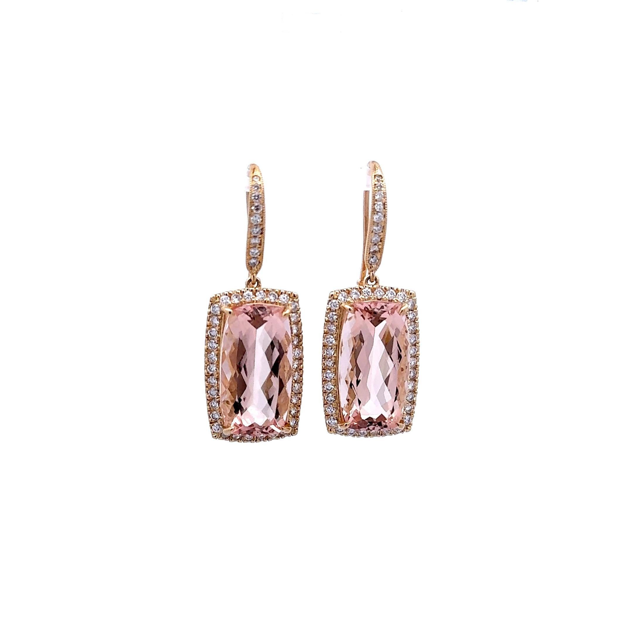 Crafted in 14k yellow gold, these exquisite drop earrings are a captivating addition to any collection. Featuring 19.28 carats of pink cushion-cut morganite, the design is enhanced by 1.54 carats of round-cut white diamonds. These earrings embody a