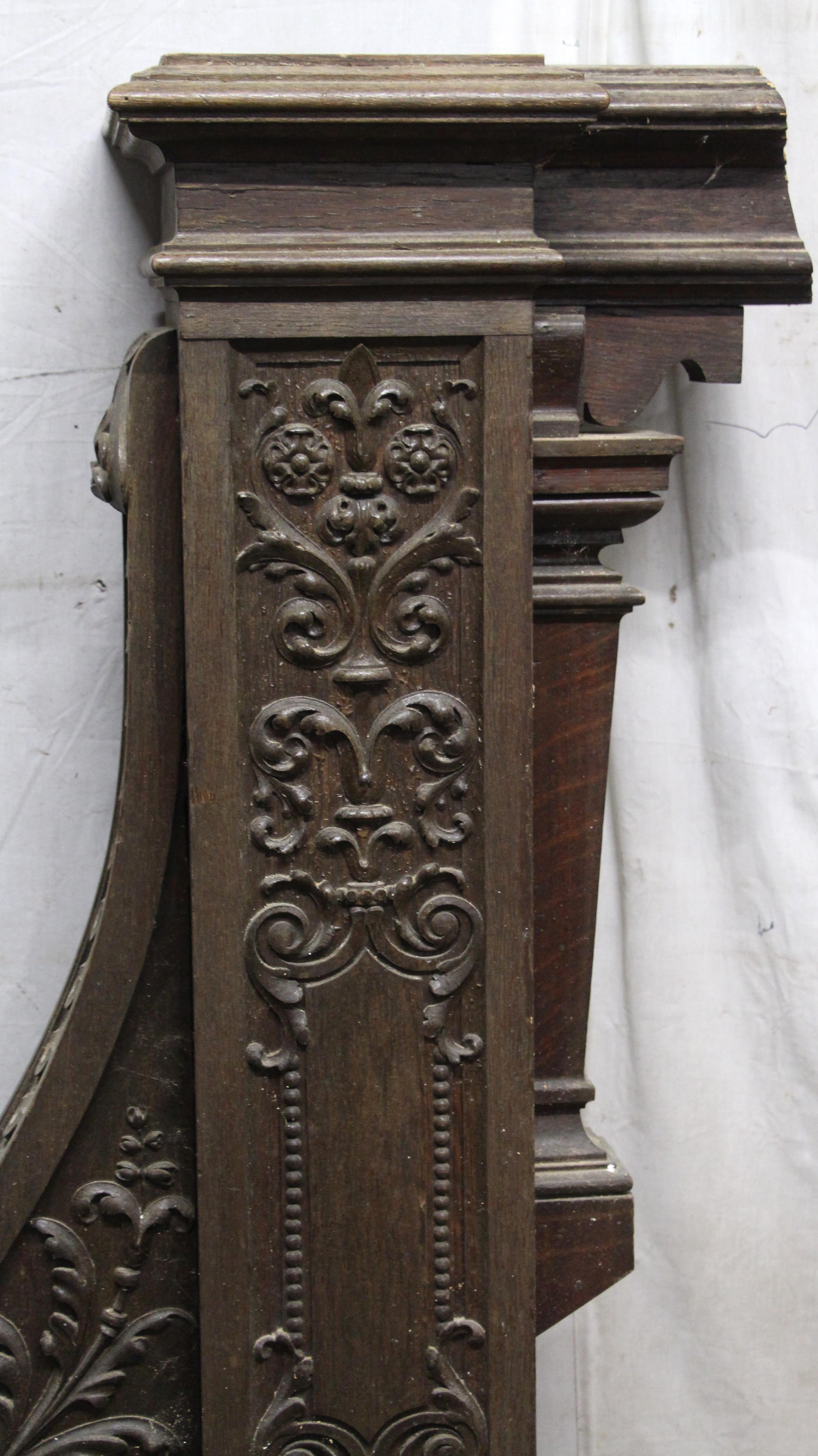 Solid dark wood tone oak carved newel post from Rose Hill, the Tudor Mansion of American impresario Billy Rose. The carving is intact, but the newel post is missing the finial. All of the woodwork from the mansion is hand carved. Some is dated and