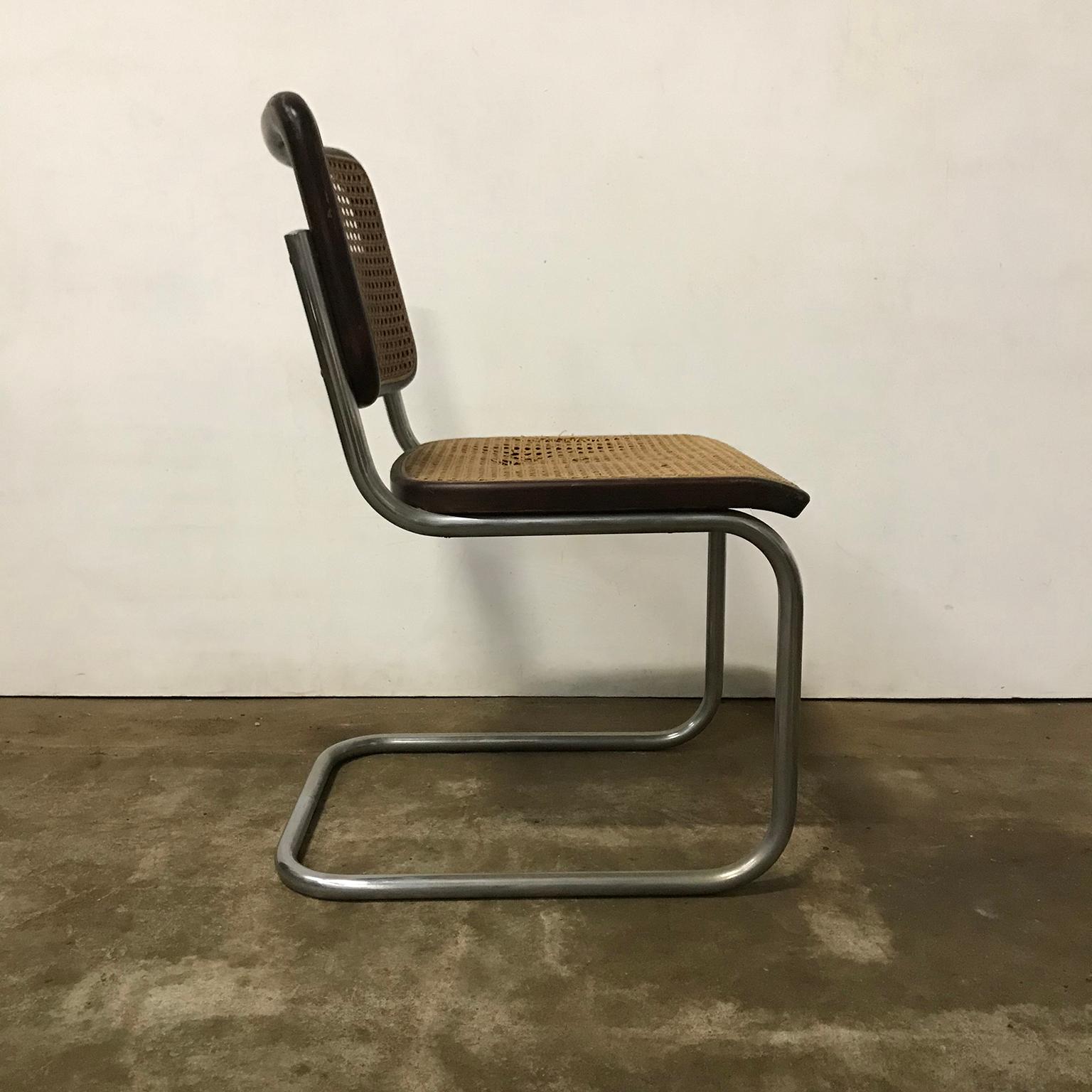 Thonet chair. The cane of the backrest is slightly darker than the cane of the seat. The chair shows some traces of wear like some scratches and spots on the wooden frames, in particular on the back at the top (picture #12). The seat has some