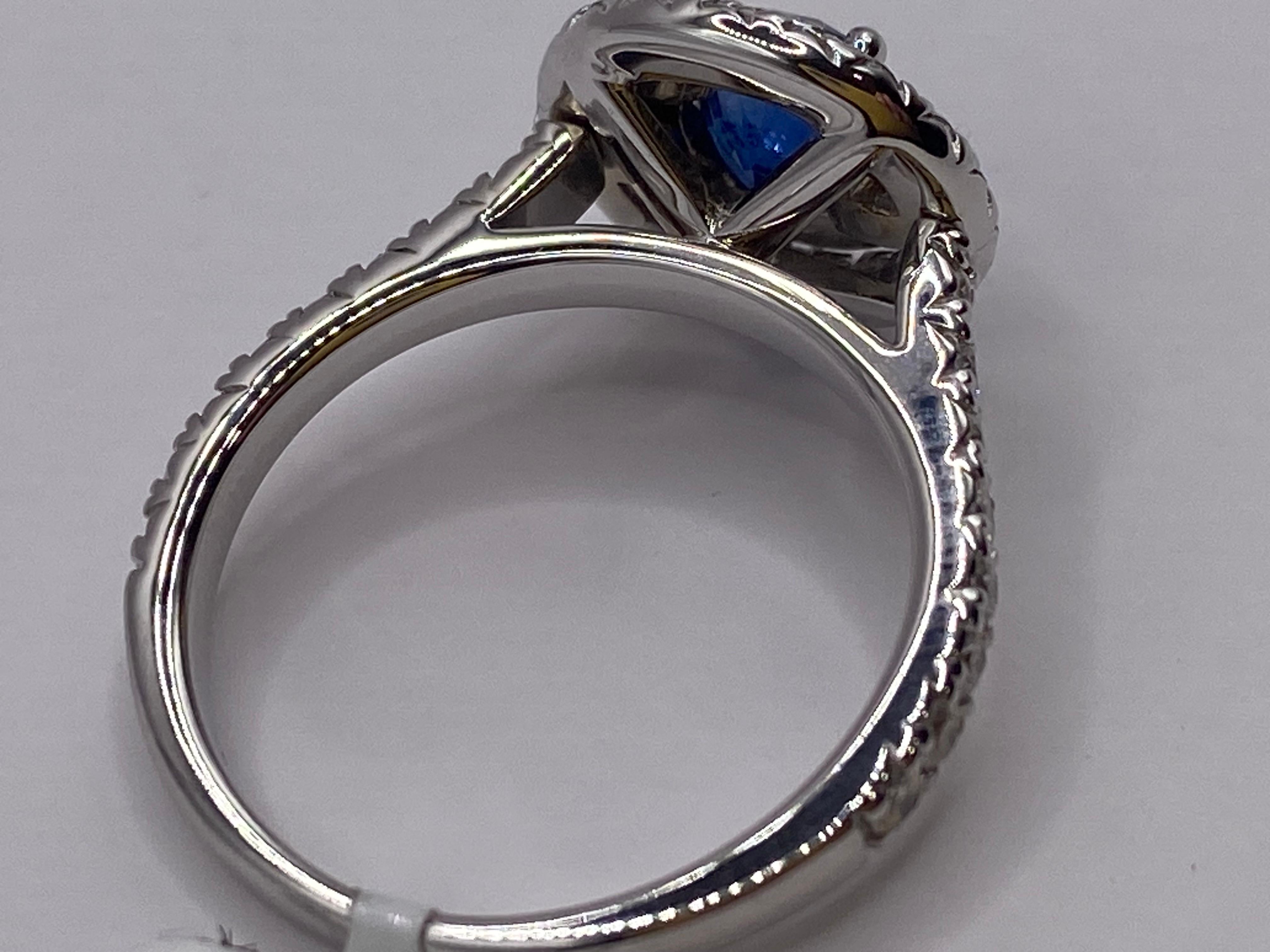 18KT White Gold
Ring Size: 6.5
(ring is size 6.5, but it sizable upon request)

Number of Sapphires: 1
Carat Weight: .92ctw
Stone Size: 5.25mm

Number of Diamonds: 47
Carat Weight: 1.00ctw