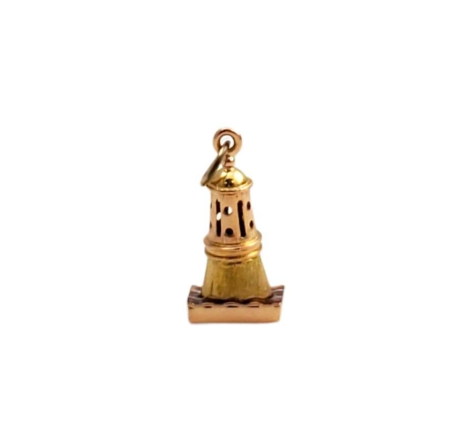 Vintage 19.2 karat yellow gold lighthouse pendant -

Illuminate your style with this beautiful lighthouse pendant that is set in meticulously detailed 19.2K yellow gold with red enamel.

Size: 12.91mm x 19.02mm

Tested 19.2K Yellow Gold 

Stamped