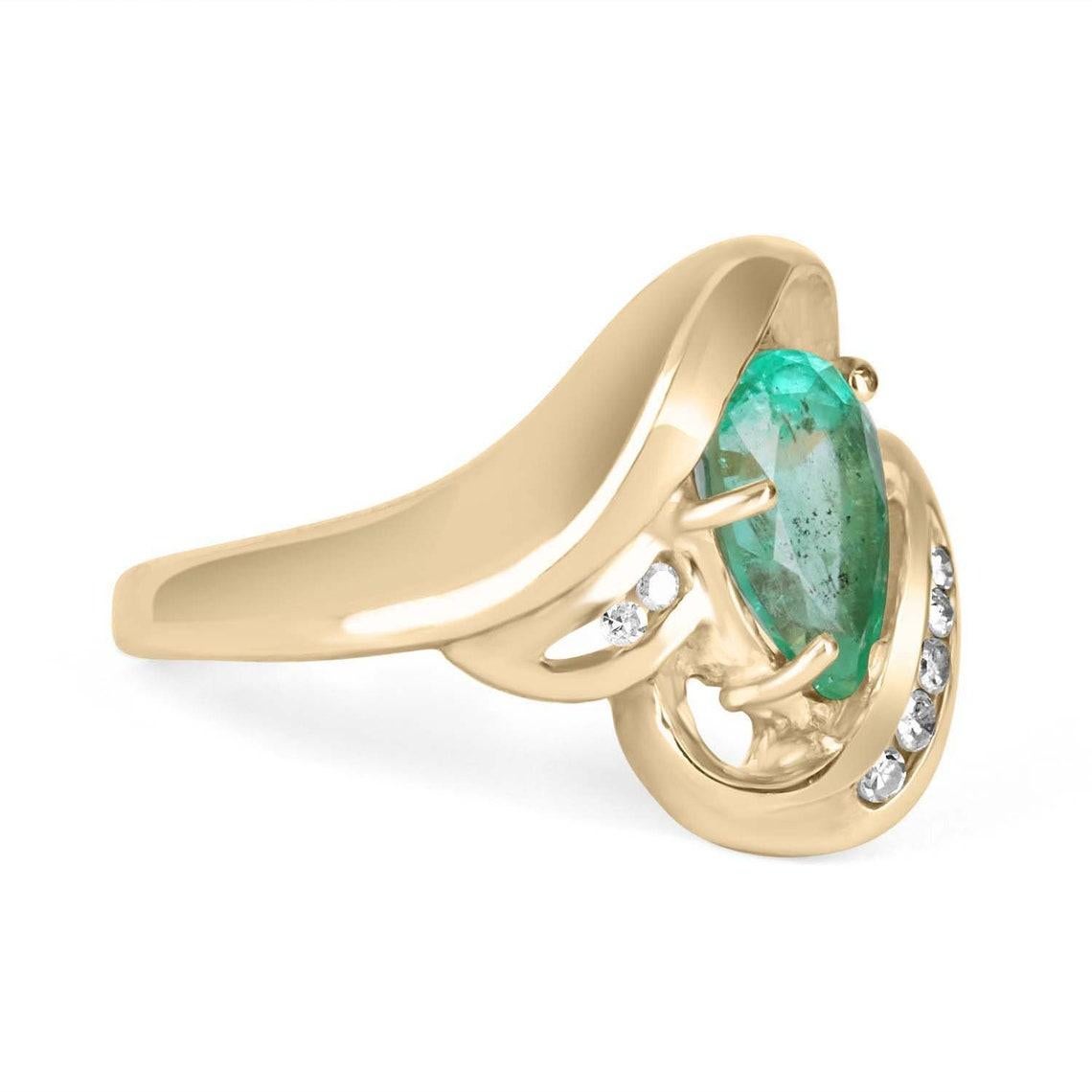 A stunning, pear shape emerald and diamond statement ring, right-hand ring, or just for everyday wear! This gorgeous piece is sure to receive many compliments. An alluring, bluish-green 1.92ct, natural Colombian emerald Emerald cut is nestled in a