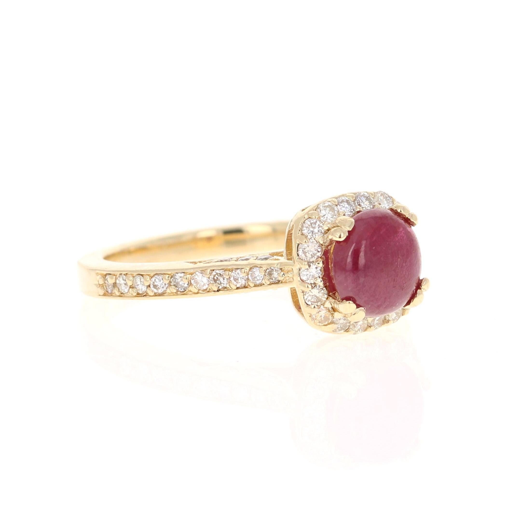 Simply beautiful Ruby Diamond Ring with a Cushion Cut Cabochon 1.43 Carat Ruby which is surrounded by 40 Round Cut Diamonds that weigh 0.50 carats. The total carat weight of the ring is 1.93 carats. 

The ring is curated in 14K Yellow Gold and