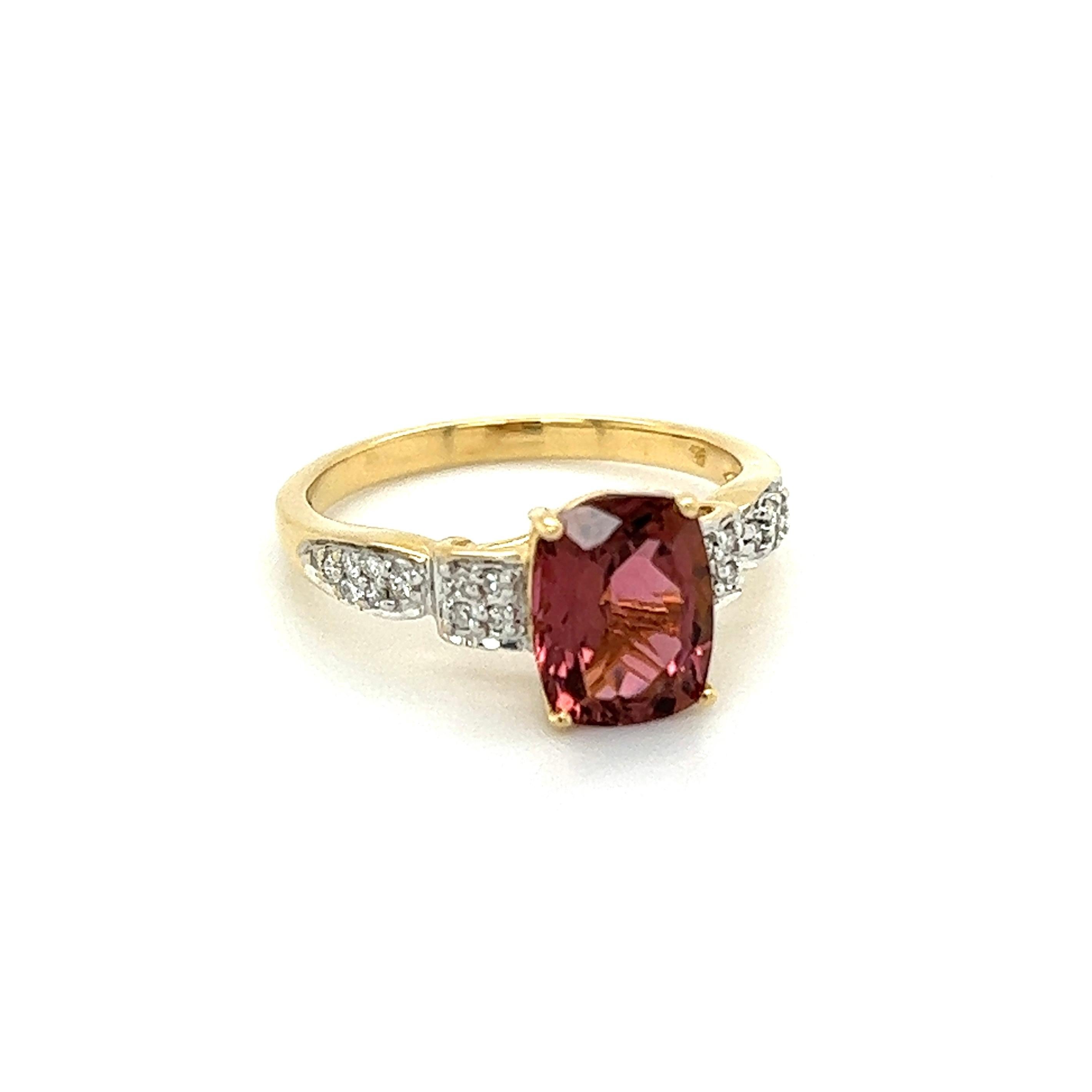 Simply Beautiful! Finely detailed Aquamarine and Diamond Gold Cocktail Ring. Centering a Hand set securely nestled 1.93 Carat Cushion Pink Tourmaline, accented on either side by Round Brilliant-cut Diamonds, weighing approx. 0.20tcw. Hand crafted