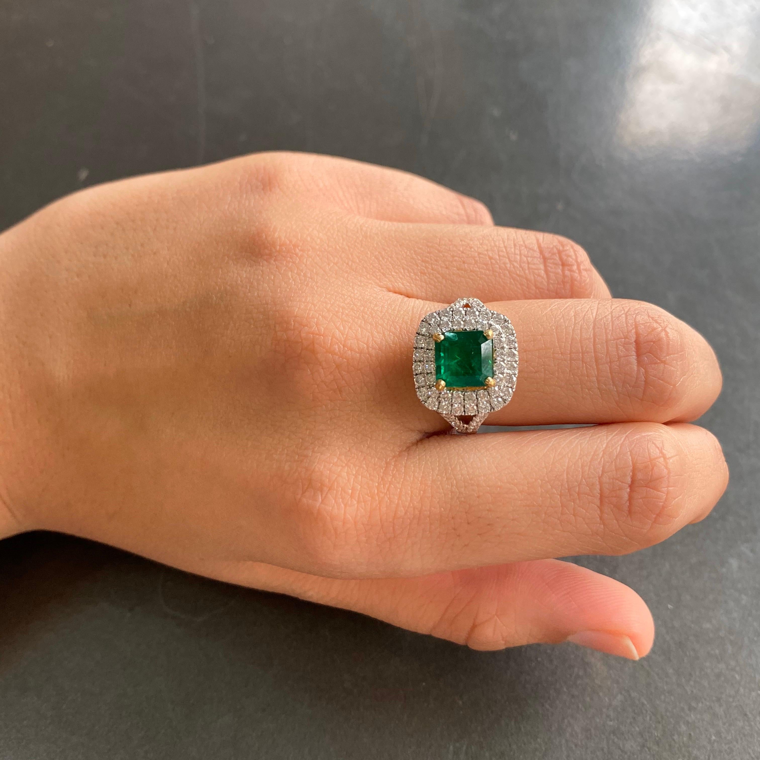 A beautiful 1.93 carat Zambian Emerald and Diamond ring set in 18K white gold. 
The stone is transparent, with very few natural inclusions, and a beautiful lustre. The pictures depict the actual colour/quality of the centre stone. Currently a ring