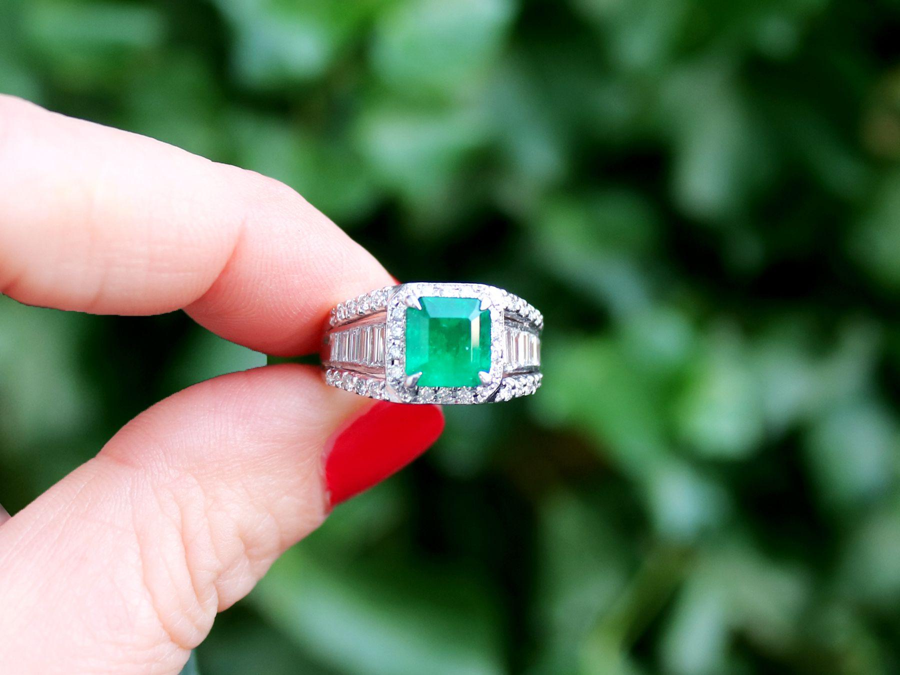 A fine and impressive contemporary 1.93 carat natural emerald and 0.92 carat diamond, platinum dress ring; part of our contemporary jewelry and estate jewelry collections.

This fine large, contemporary emerald and diamond dress ring has been