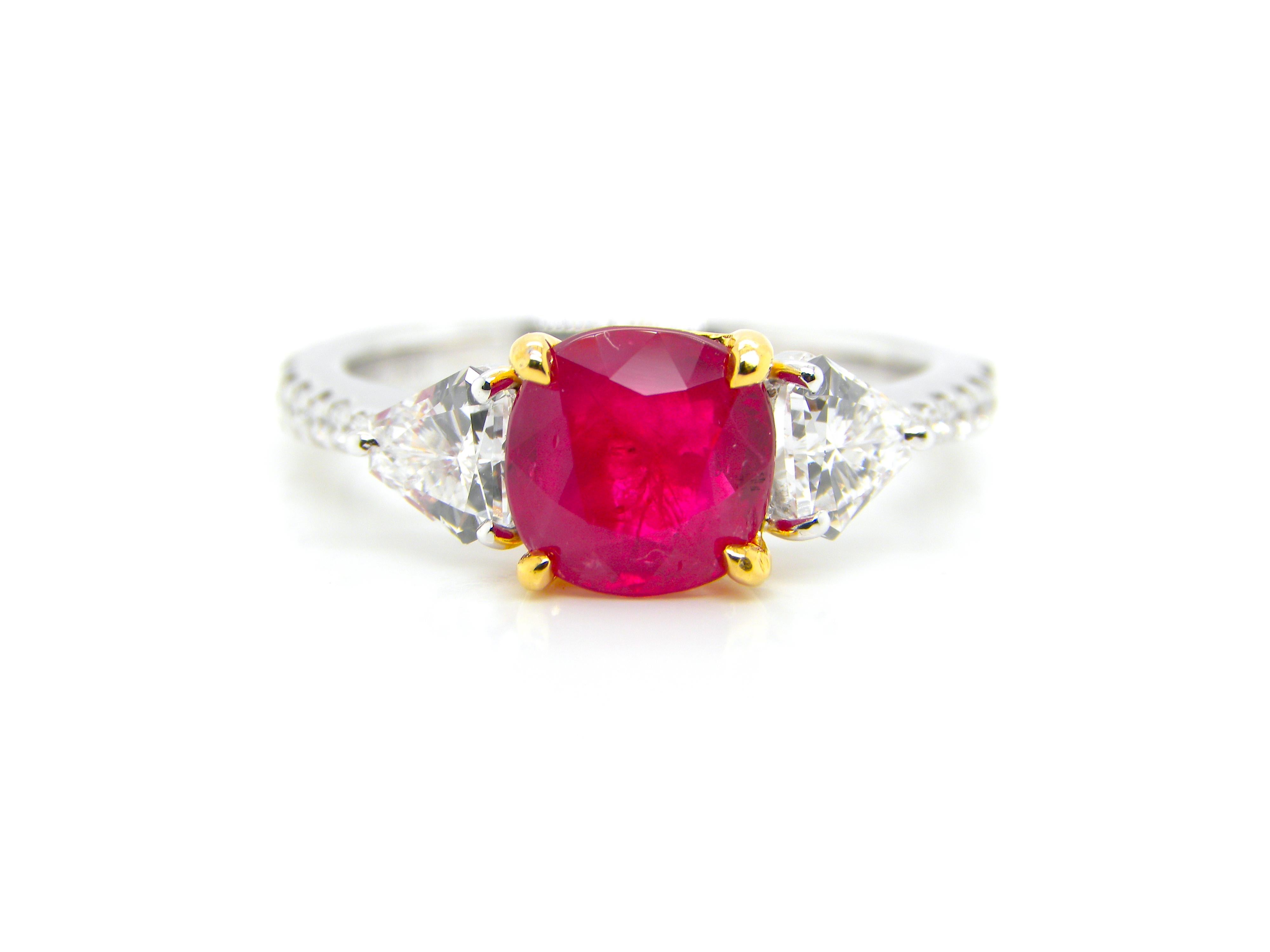 1.93 Carat GIA Certified Burma No Heat Pigeon's Blood Red Ruby and Diamond Ring:

A beautiful three-stone ring, it features a gorgeous GIA certified unheated Burmese pigeon's blood red ruby weighing 1.93 carat flanked by super-white shield cut