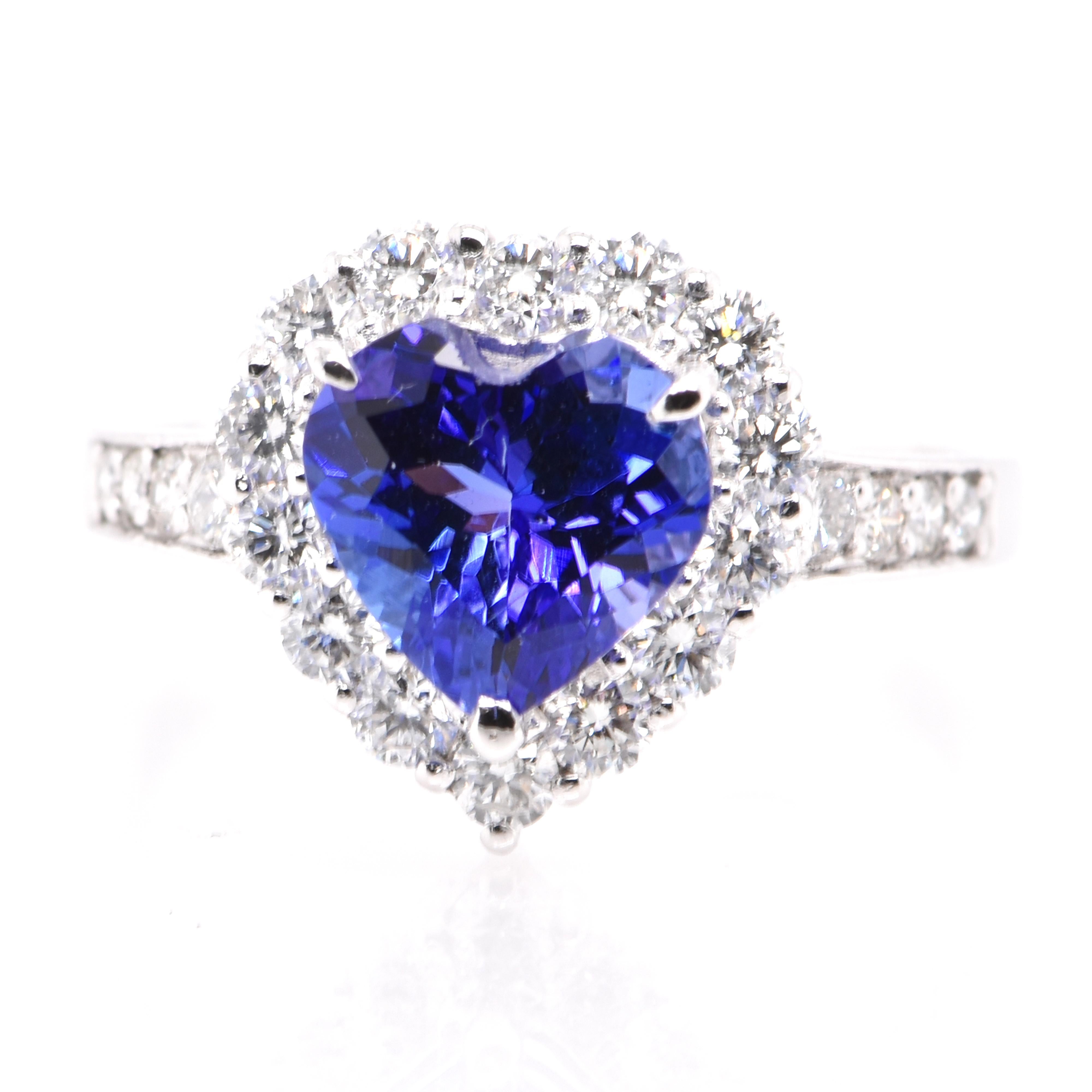 A beautiful ring featuring a 1.93 Carat Natural Tanzanite and 0.68 Carats of Diamond Accents set in Platinum. Tanzanite's name was given by Tiffany and Co after its only known source: Tanzania. Tanzanite displays beautiful pleochroic colors meaning