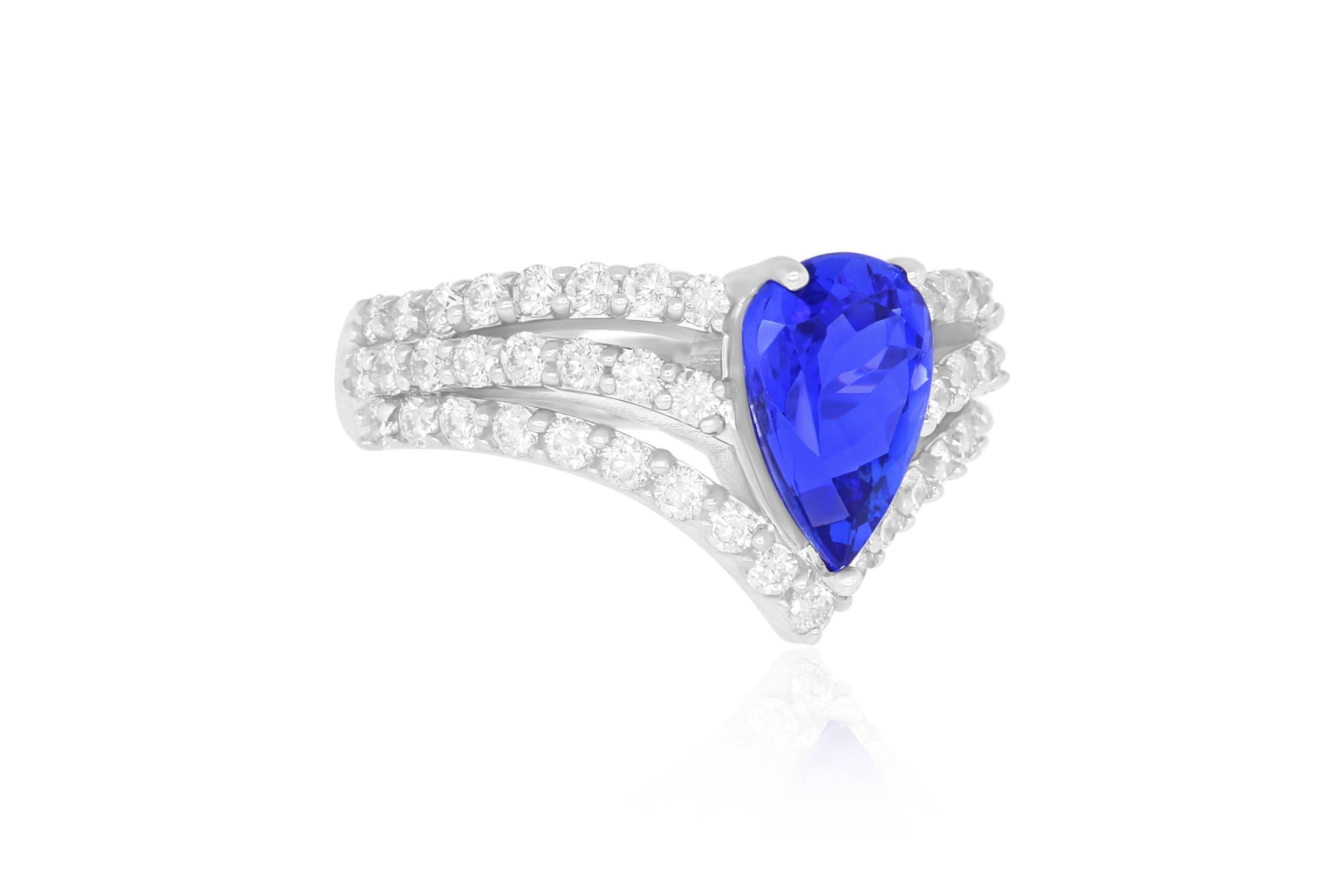 14k White Gold
Center Stone: 1 Tanzanite at 1.93 carats
Diamonds: 51 Brilliant White Round Diamonds at 0.95 carats - Color: HI - Clarity: SI
Ring Size: Size 6.5. Alberto offers complimentary sizing on all rings.

Fine one-of-a-kind craftsmanship