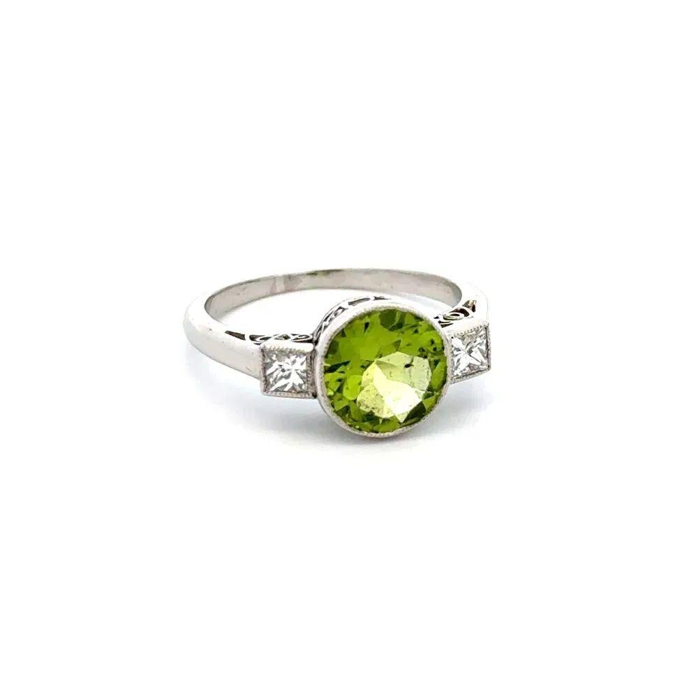 Simply Beautiful! Peridot and Diamond Gold Vintage Solitaire Ring. Centering a securely nestled Hand set Peridot Gemstone, weighing approx. 1.93 Carat. Accented by Diamonds, approx. 0.30tcw. Hand crafted Platinum Filigree mounting. Ring Size 5.25,