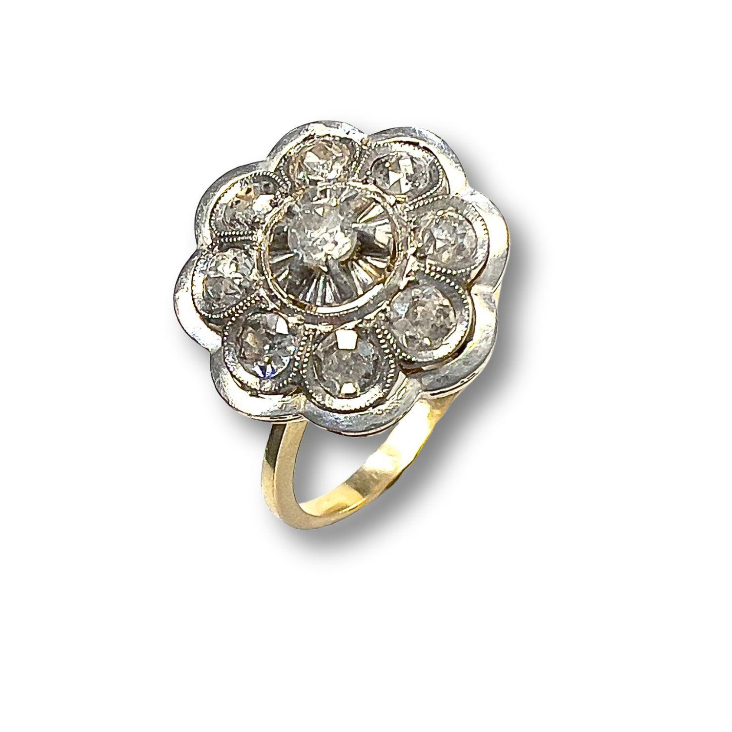 Indulge in the timeless elegance of the Art Deco era with this exquisite 18-karat yellow gold ring adorned with antique cut diamonds. Dating back to the 1930s, this ring is a true testament to the glamour and sophistication of its era.
What sets