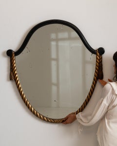 1930-1939 France Deep Ebony Black Carved Wood Oval Mirror With Gilt Rope Trim