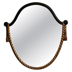 1930-1939 France Deep Ebony Black Carved Wood Oval Mirror With Gilt Rope Trim