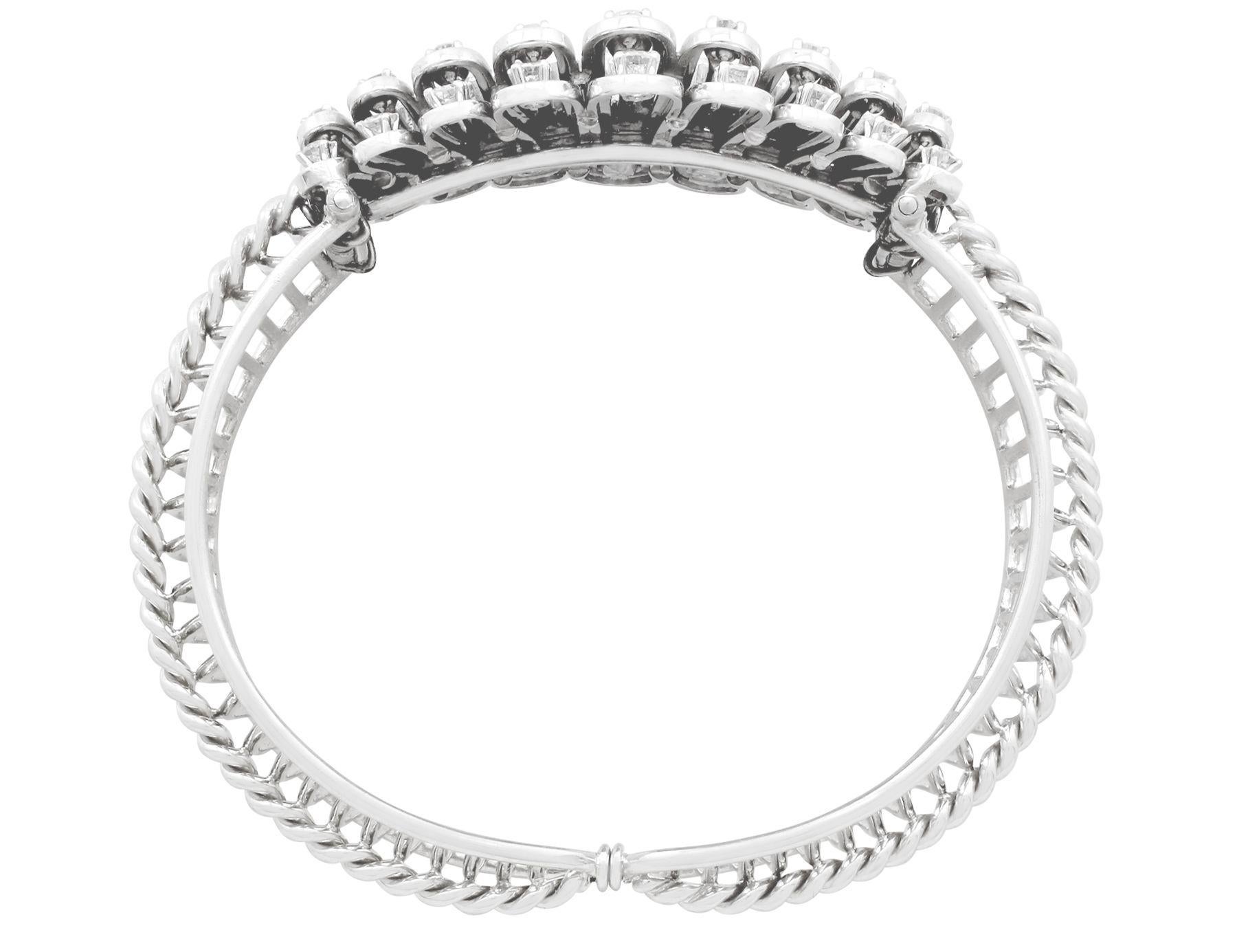 A stunning antique 1930s 4.87 carat diamond and 18 karat white gold bangle; part of our diverse antique jewelry and estate jewelry collections.

This stunning, fine and impressive antique diamond bangle has been crafted in 18k white gold.

The
